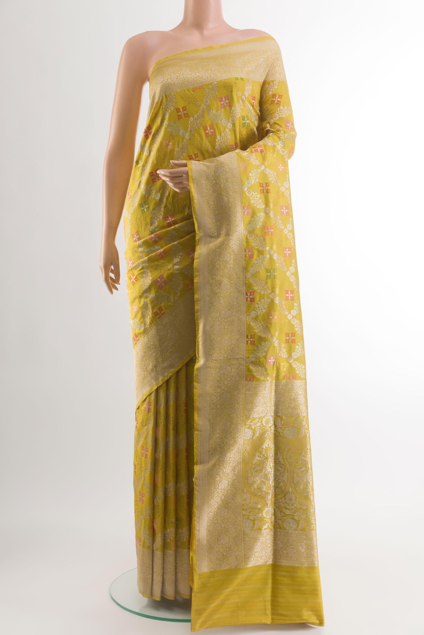 Yellow Banarasi Silk Saree with Zari Brocade on the body and Zari Border.  displayed on a mannequin