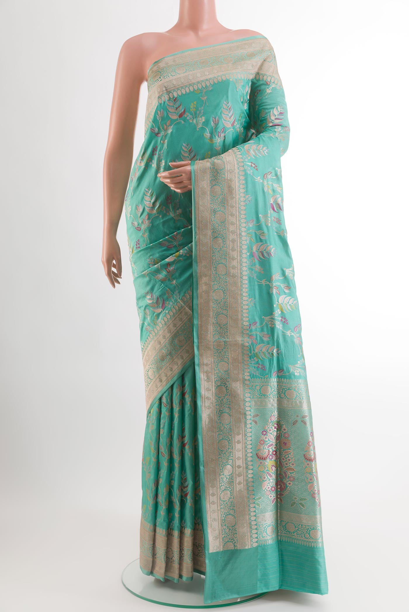 Light Blue Banarasi Silk Saree with Zari And Thread Butta on the body and Zari Border.  displayed on a mannequin