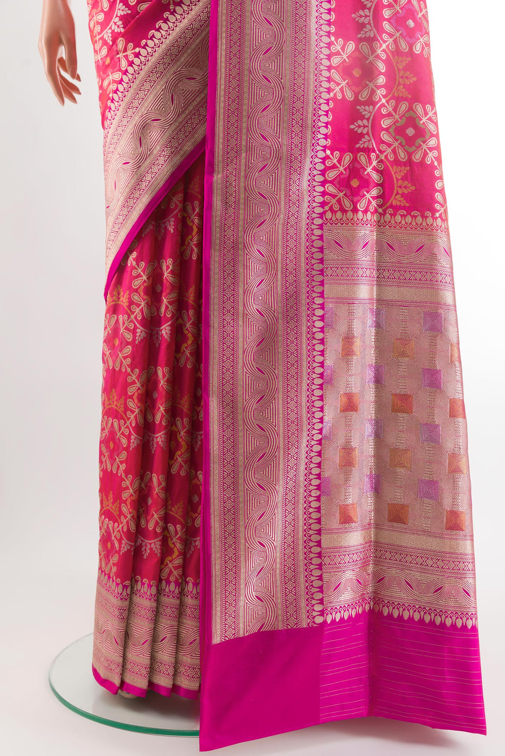 Pleats and pallu of Rani Pink Banarasi Silk Saree with Zari Brocade on the body and Zari Border. 
