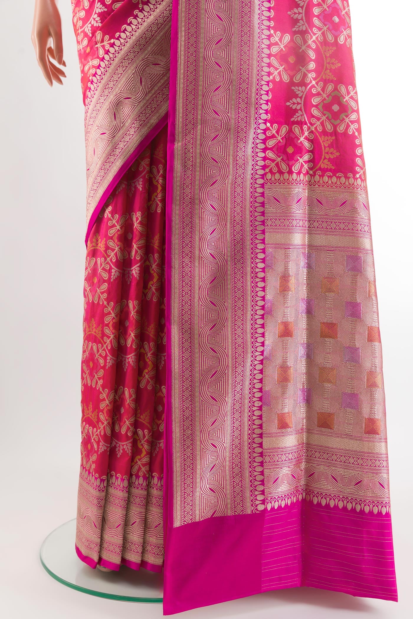 Pleats and pallu of Rani Pink Banarasi Silk Saree with Zari Brocade on the body and Zari Border. 