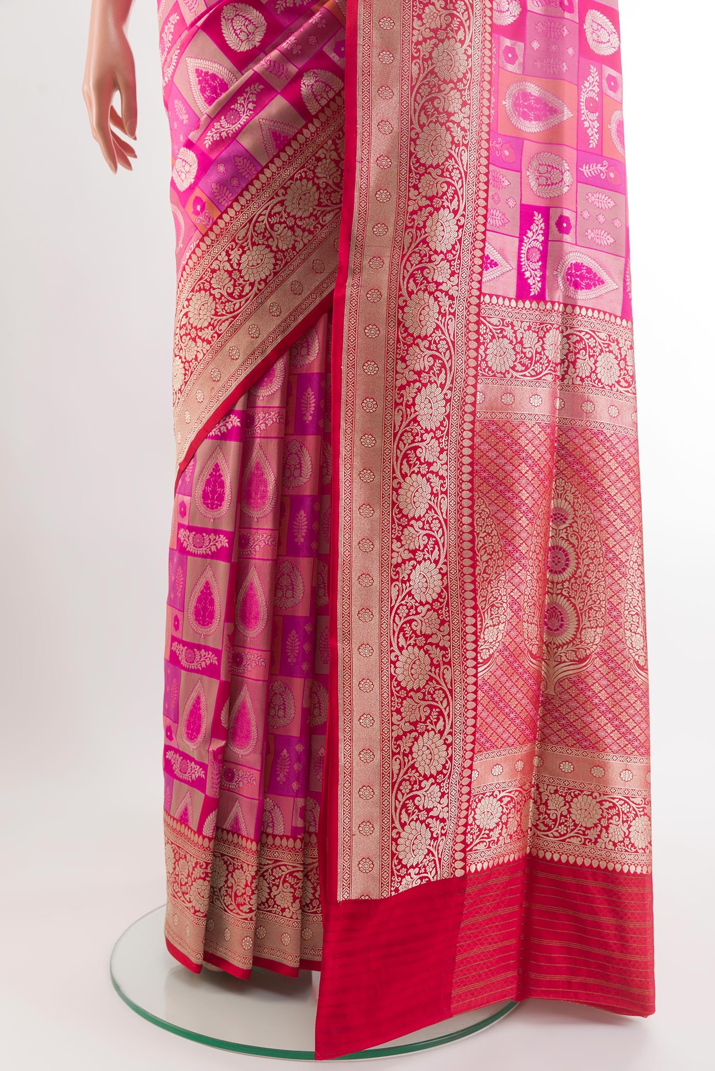 Pleats and pallu of Rani Pink Banarasi Silk Saree with Zari Brocade on the body and Zari Border. 
