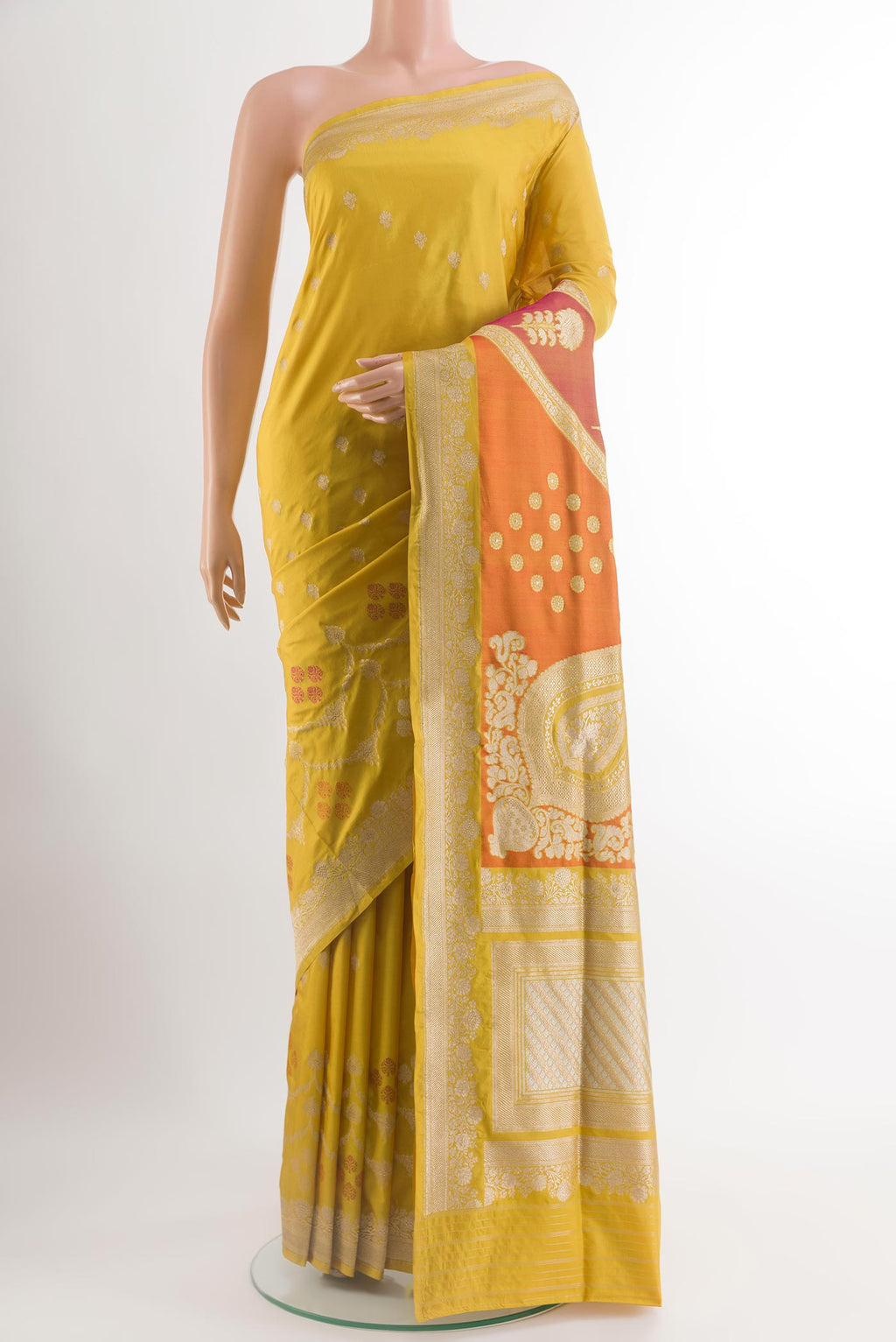 Yellow Banarasi Silk Saree with Zari Butta on the body and Zari Border.  displayed on a mannequin