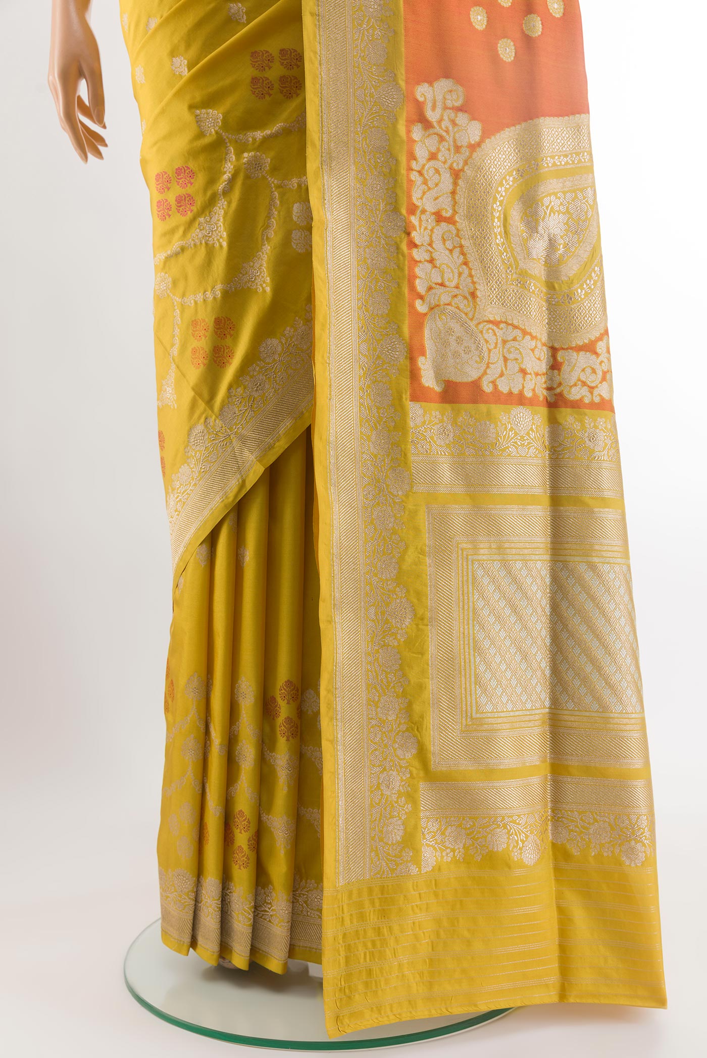 Pleats and pallu of Yellow Banarasi Silk Saree with Zari Butta on the body and Zari Border. 