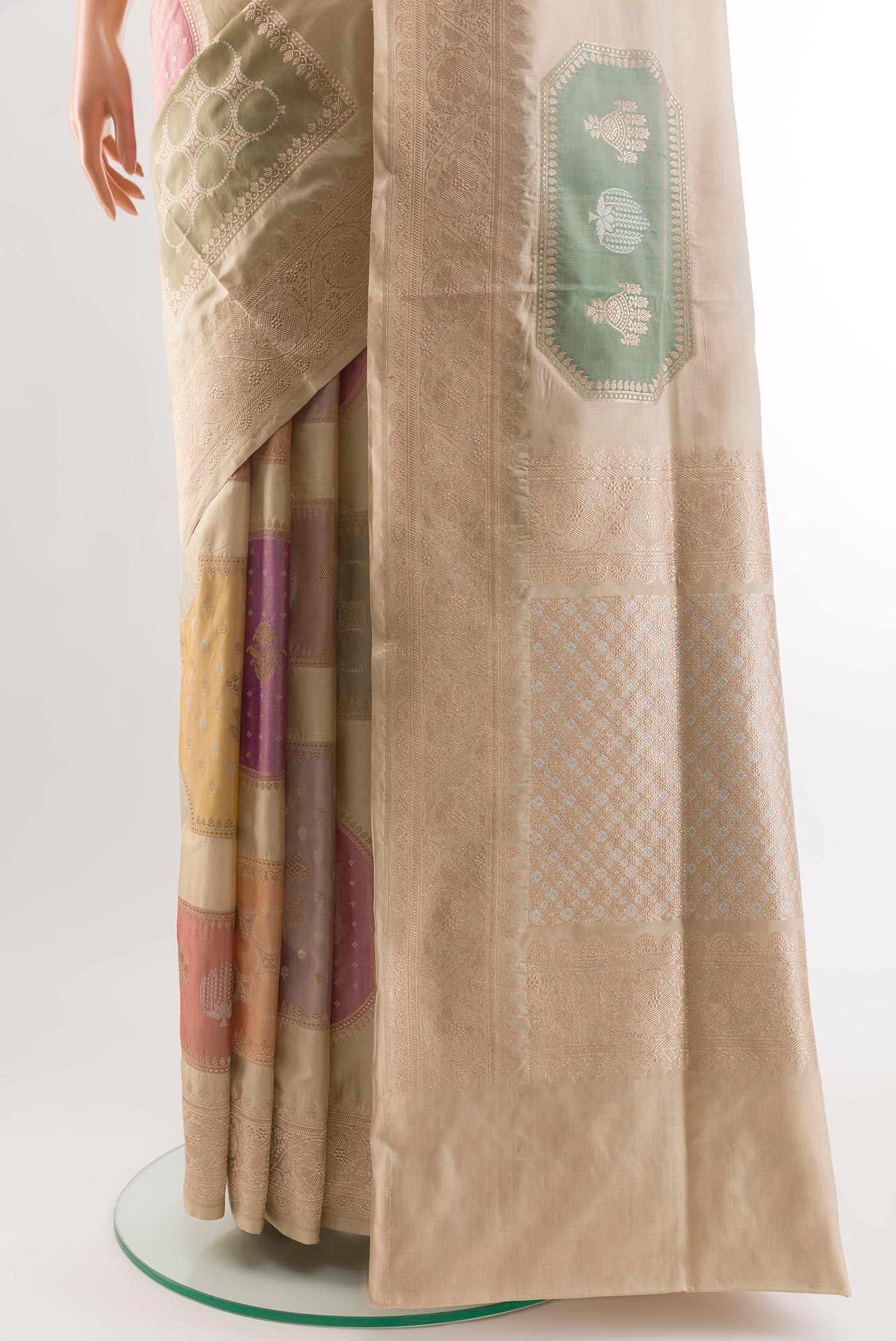 Pleats and pallu of Beige Banarasi Silk Saree with Zari Brocade on the body and Zari Border. 