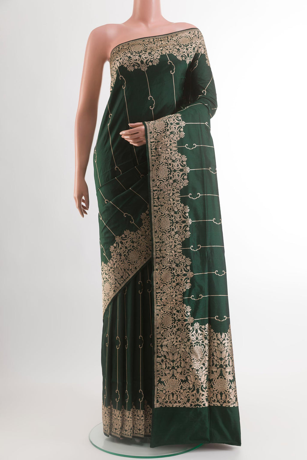 Bottle Green Banarasi Silk Saree with Zari Brocade on the body and Zari Border.  displayed on a mannequin