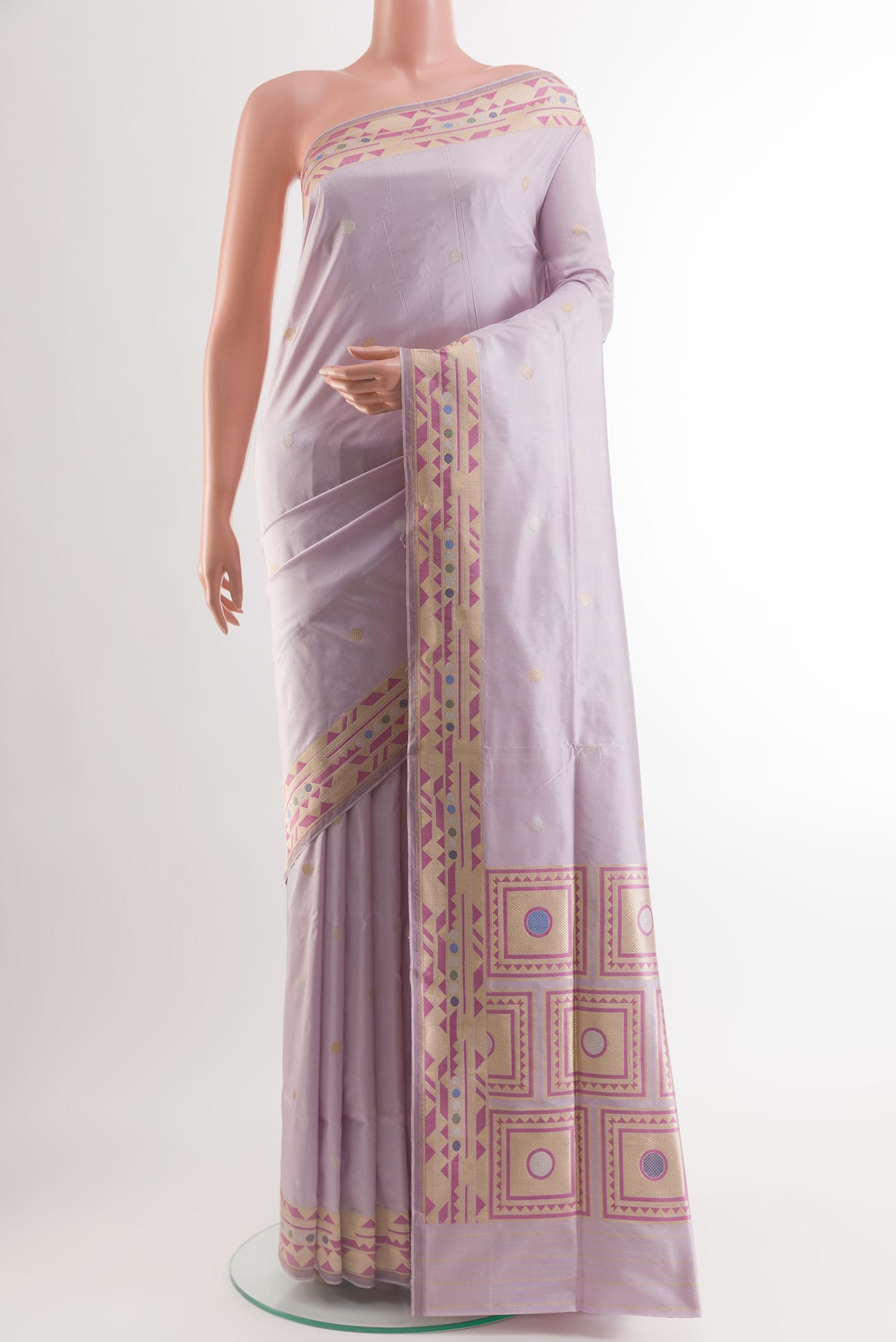 Lavender Banarasi Silk Saree with Zari Butta on the body and Zari Border.  displayed on a mannequin
