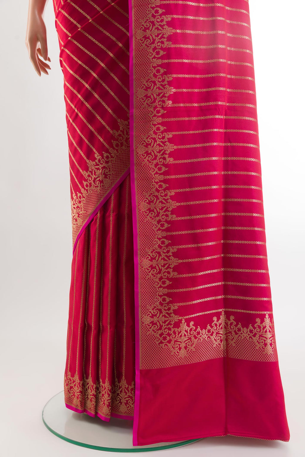 Pleats and pallu of Dark Pink Banarasi Silk Saree with Stripes on the body and Zari Border. 