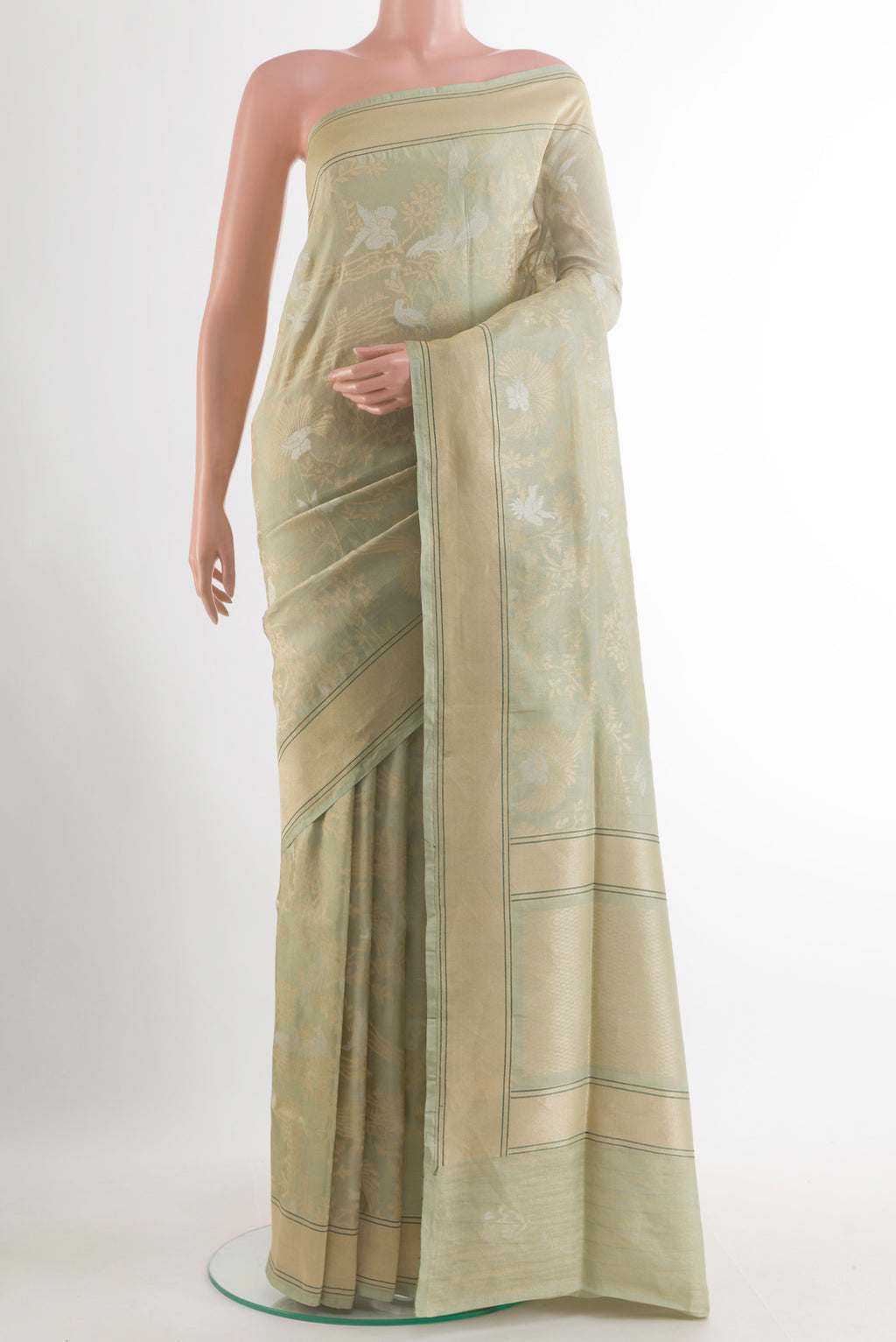 Pure Silk Light Green Banarasi Saree with Zari Brocade on the body and Zari Border.  displayed on a mannequin