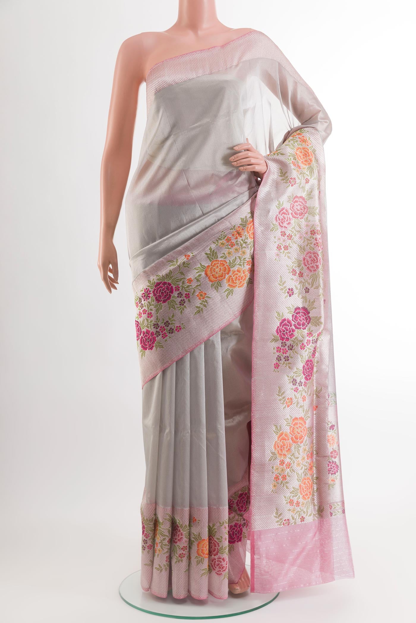 Silver Banarasi Tissue Silk Saree with Plain Body and Zari Border.  displayed on a mannequin