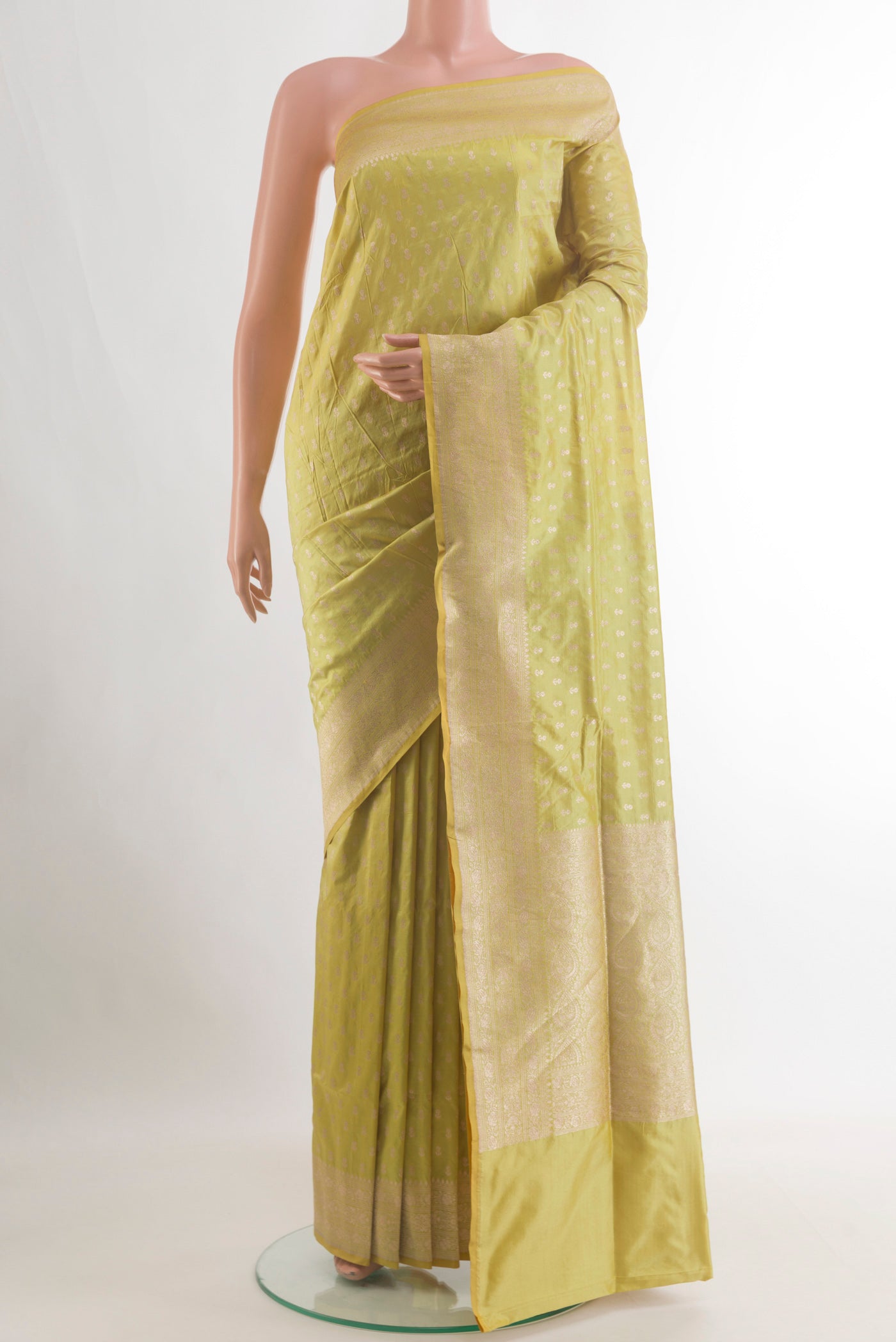 Pure Silk Yellow Banarasi Saree with Zari Brocade on the body and Zari Border.  displayed on a mannequin