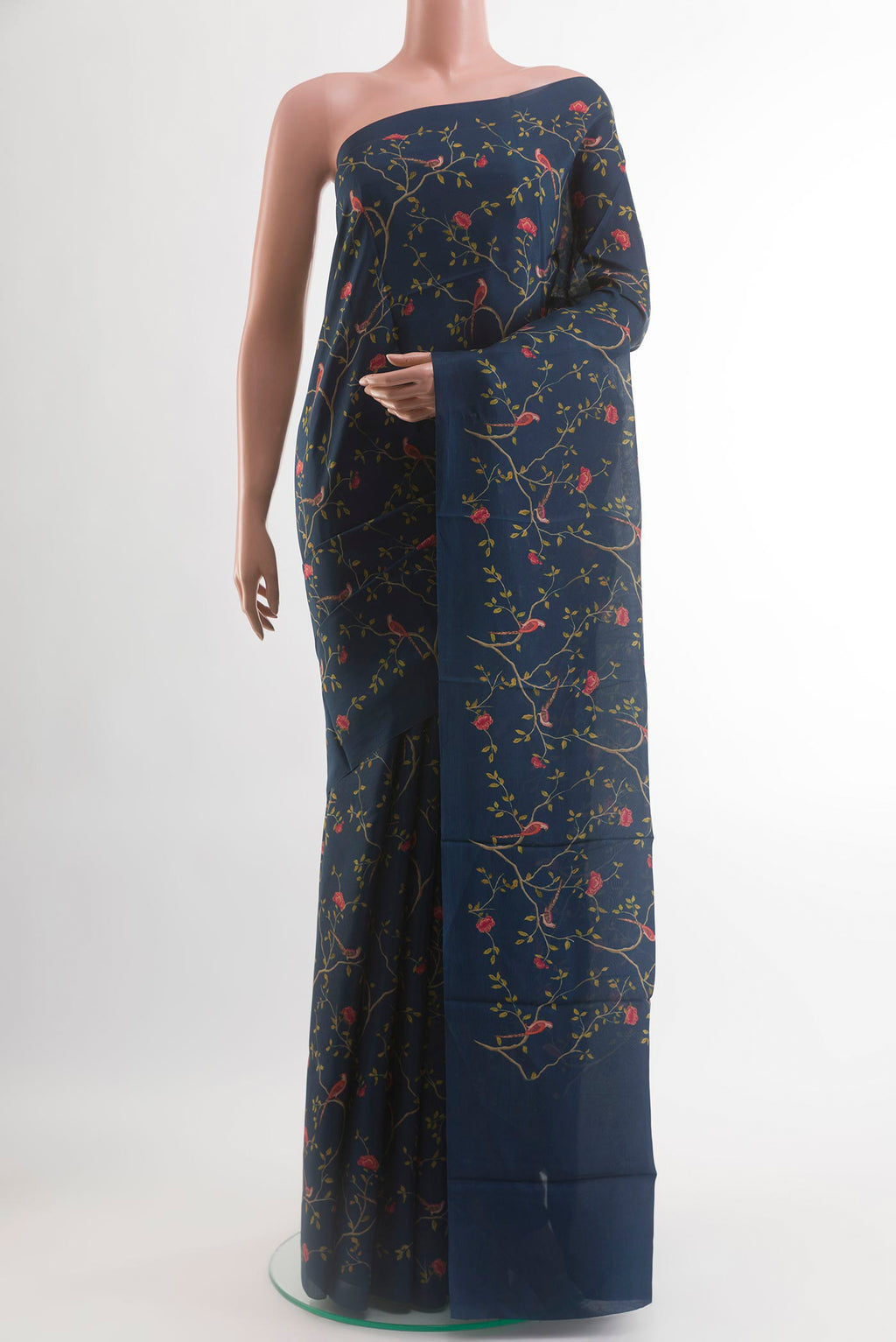 Navy Blue Printed Silk Saree with Printed design on the body and Plain Border.  displayed on a mannequin