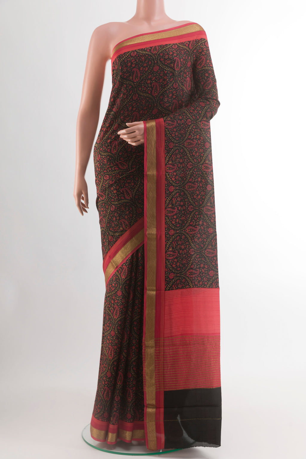 Black Crepe Saree with Printed design on the body and Zari Border.  displayed on a mannequin