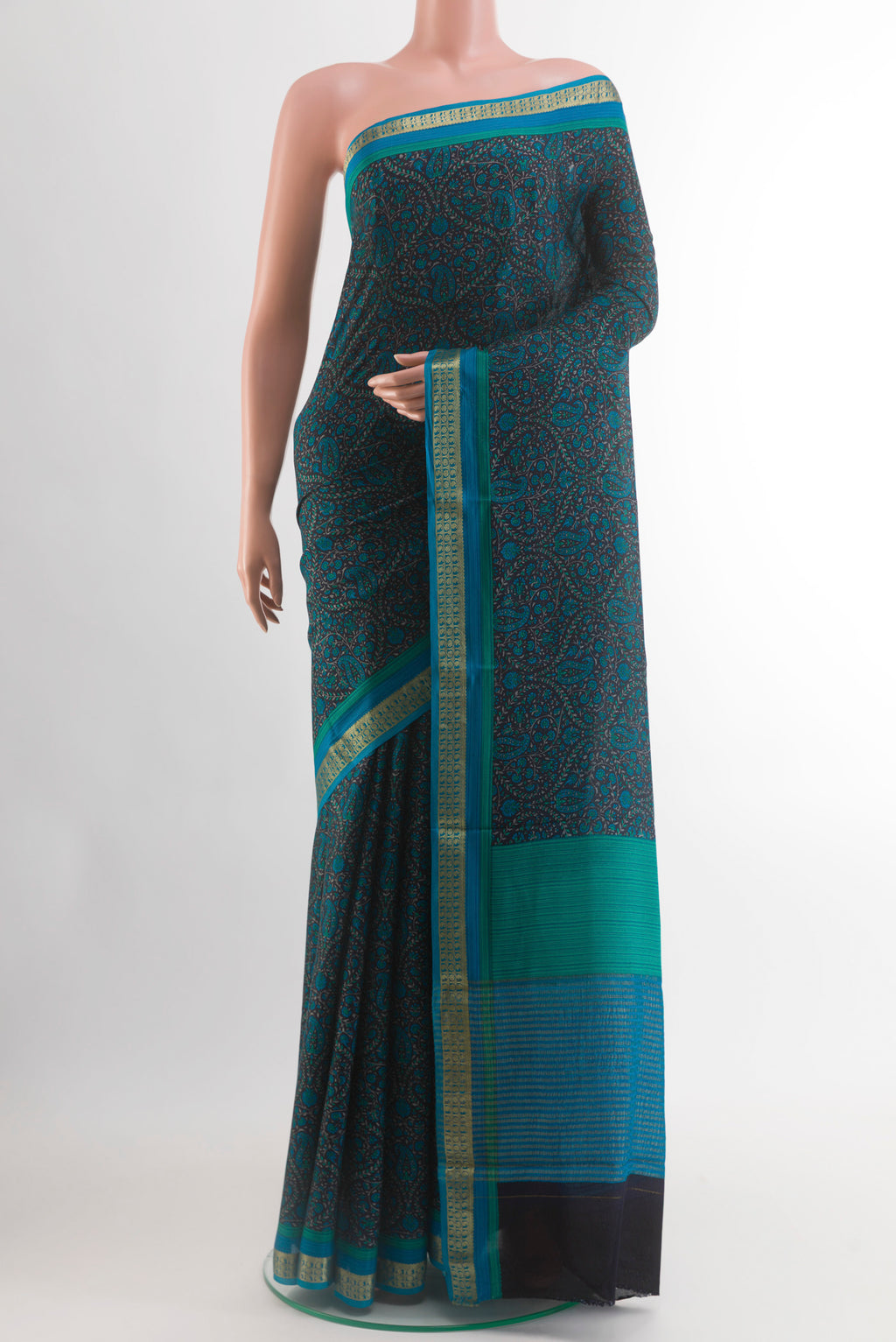 Navy Blue Crepe Saree with Printed design on the body and Zari Border.  displayed on a mannequin