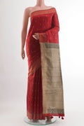 Red Tussar Silk Saree with Embroidery on the body and Embroidery Border.  displayed on a mannequin