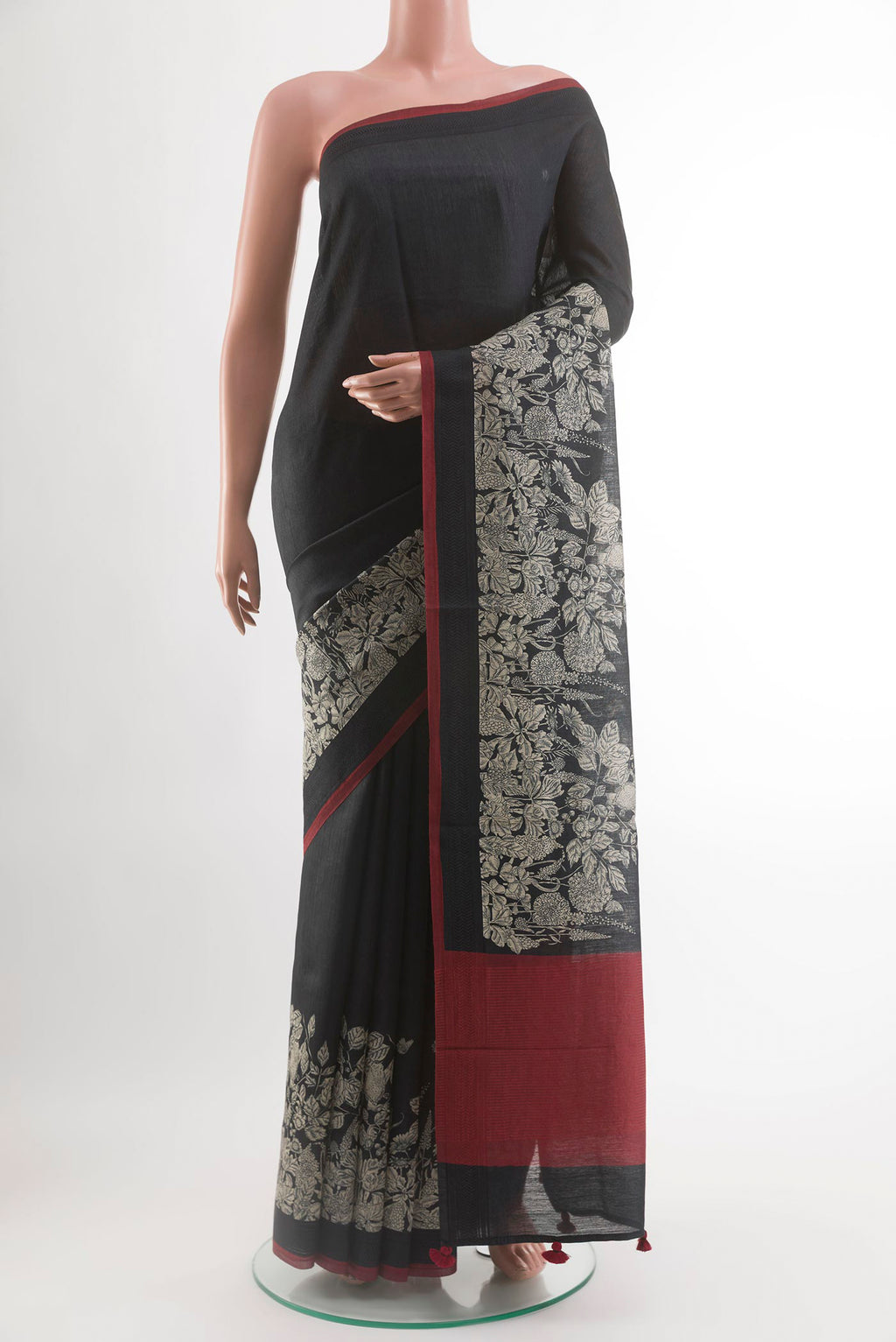 Black Tussar Silk Saree with Plain Body and Embroidery Border.  displayed on a mannequin