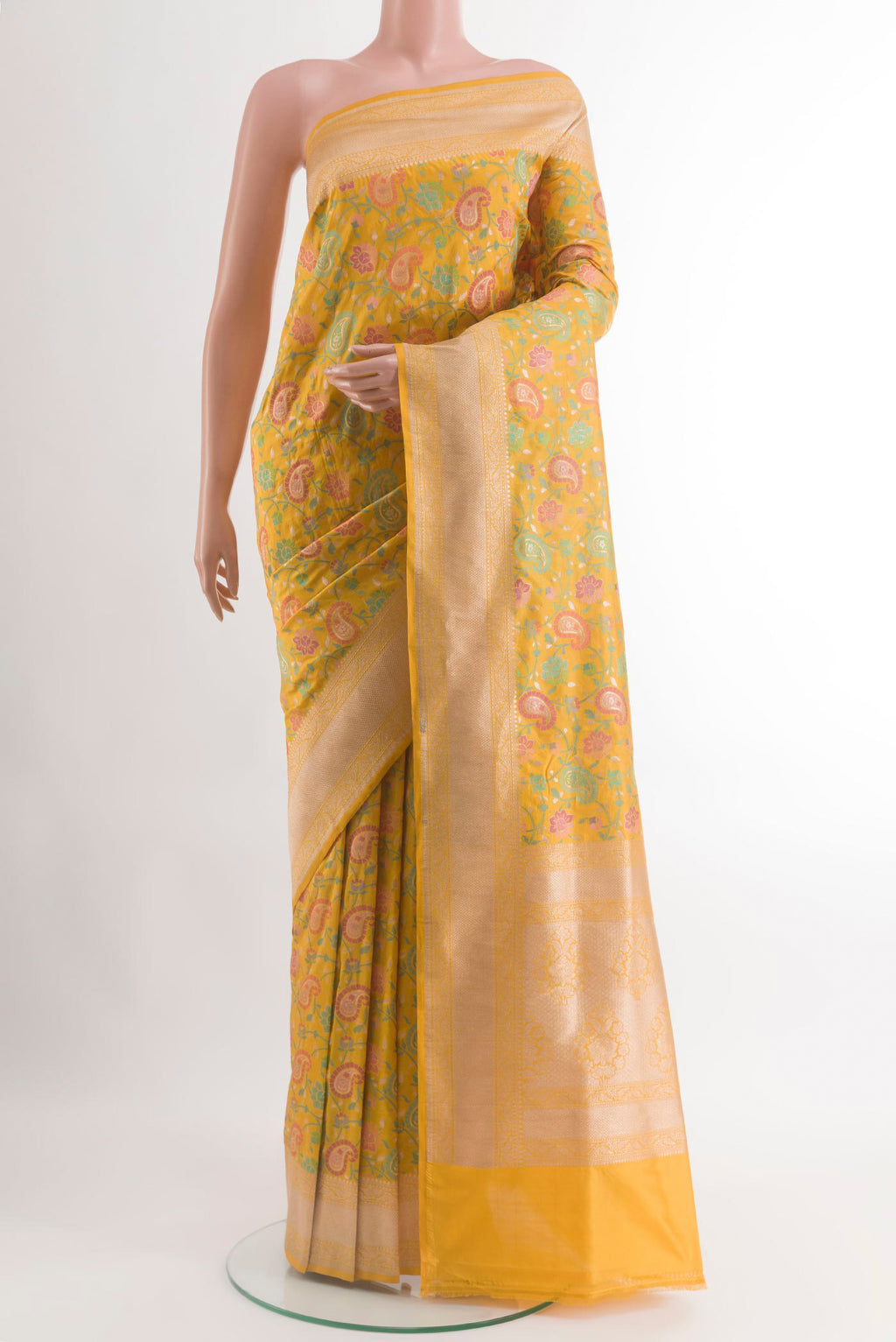 Yellow Banarasi Silk Saree with Zari And Thread Butta on the body and Zari Border.  displayed on a mannequin