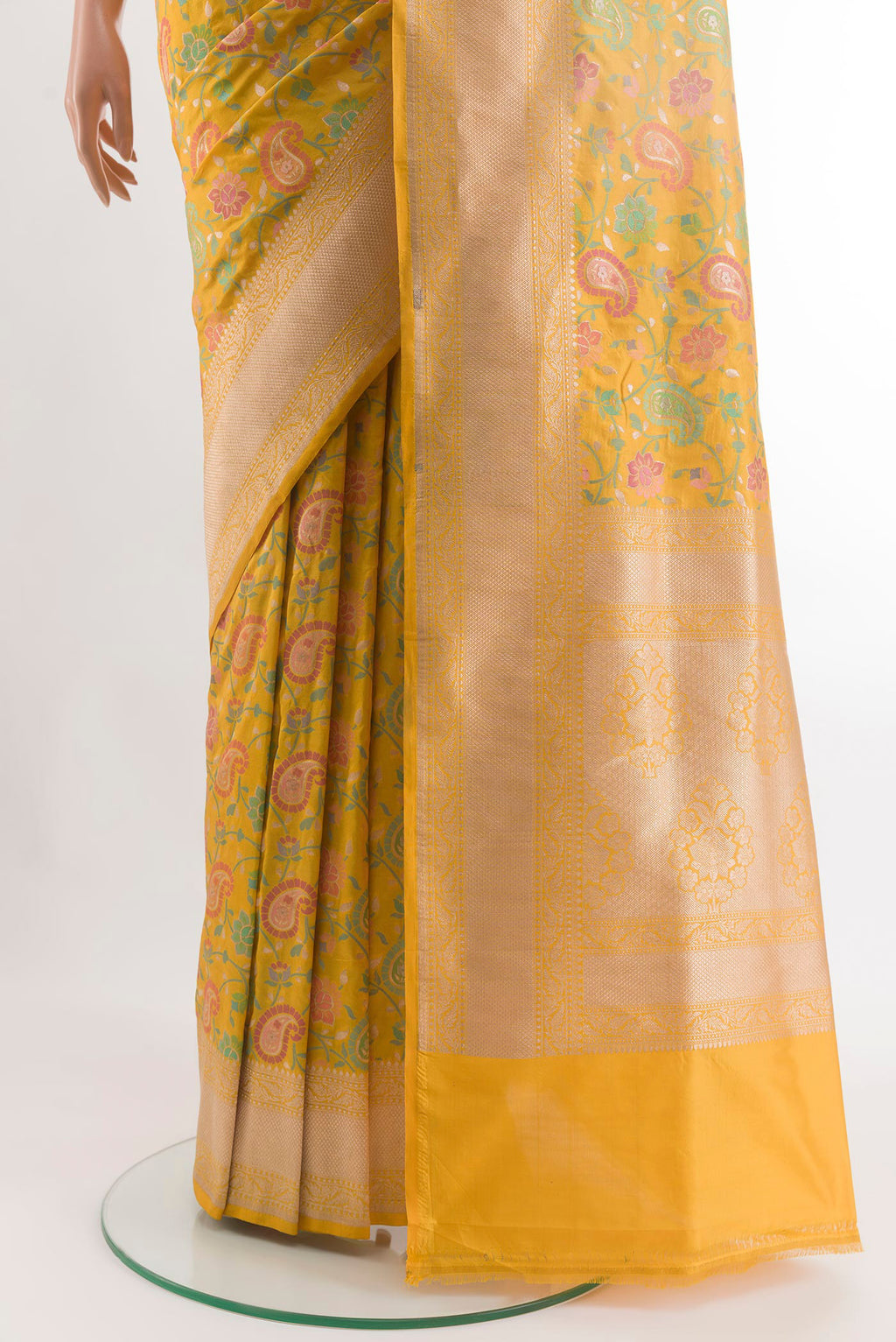Pleats and pallu of Yellow Banarasi Silk Saree with Zari And Thread Butta on the body and Zari Border. 