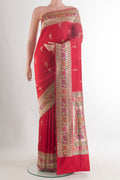 Pure Silk Red Banarasi Saree with Zari Butta on the body and Zari Border.  displayed on a mannequin
