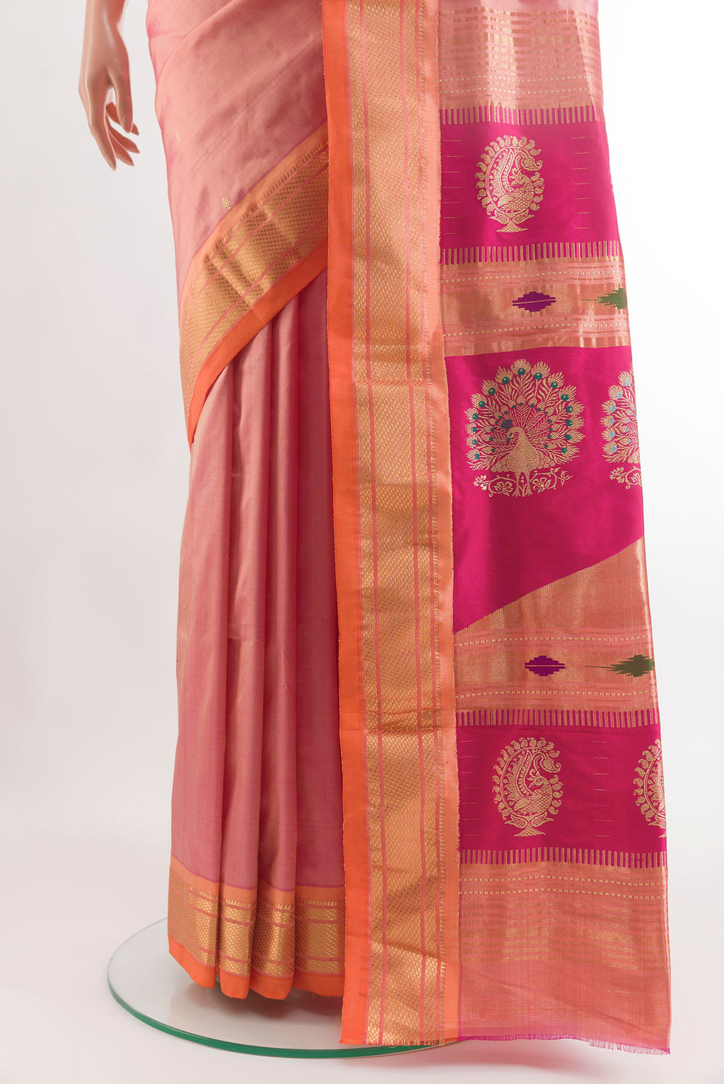 Pleats and pallu of Rose Gold Paithani Silk Saree with Zari Butta on the body and Zari Border. 