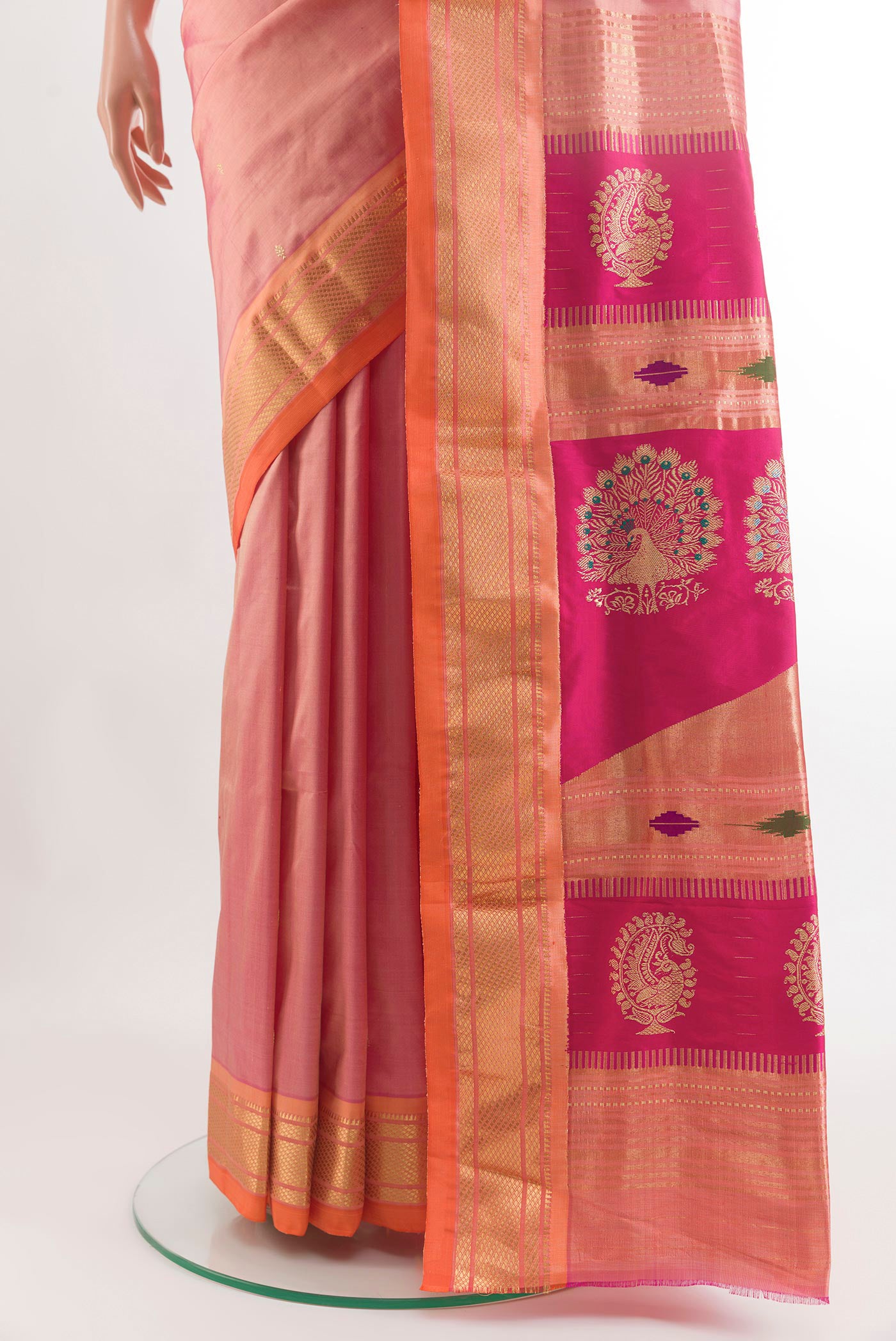 Pleats and pallu of Rose Gold Paithani Silk Saree with Zari Butta on the body and Zari Border. 