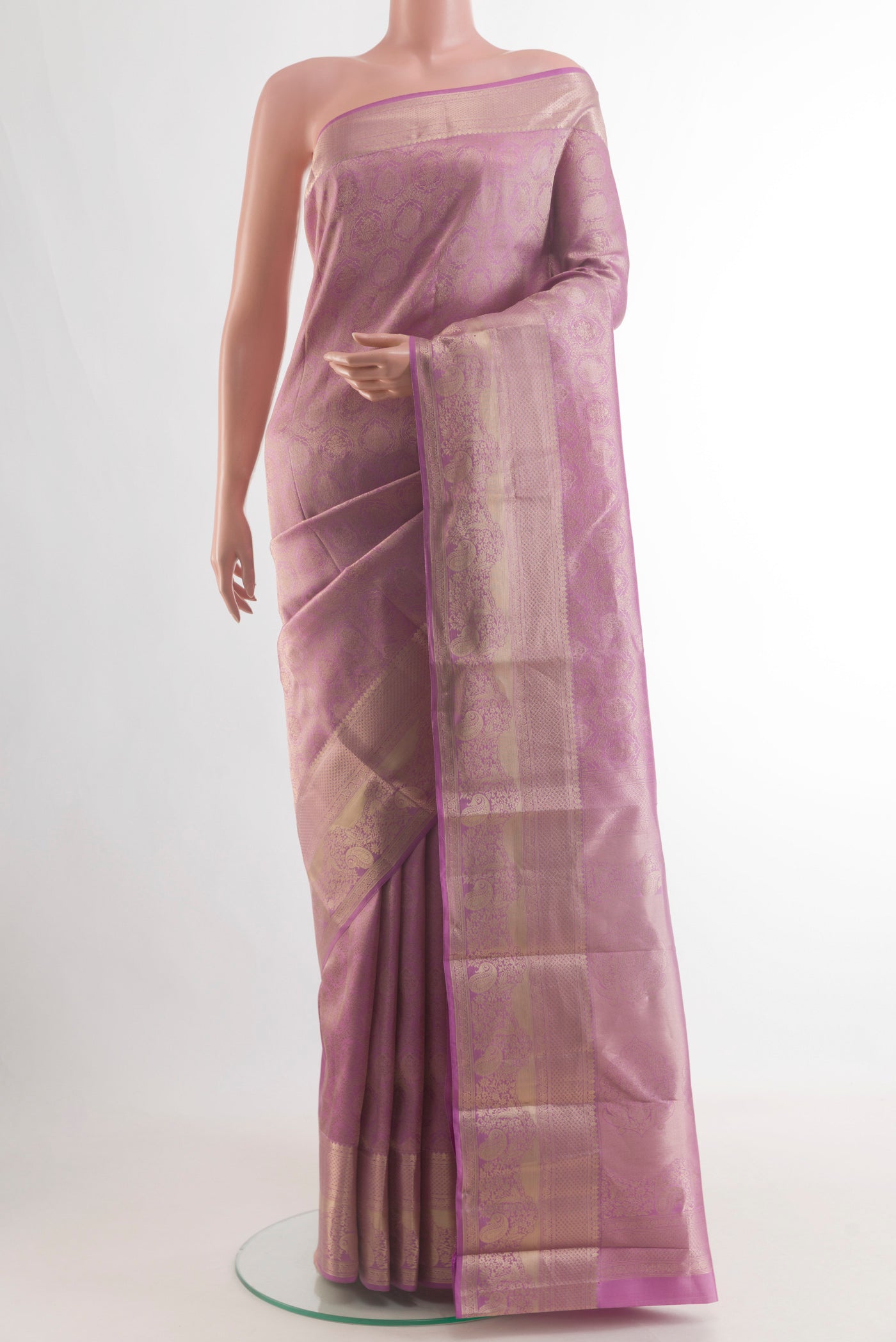 Pure Silk Lavender Kanjivaram Silk Saree with Zari Brocade on the body and Zari Border.  displayed on a mannequin