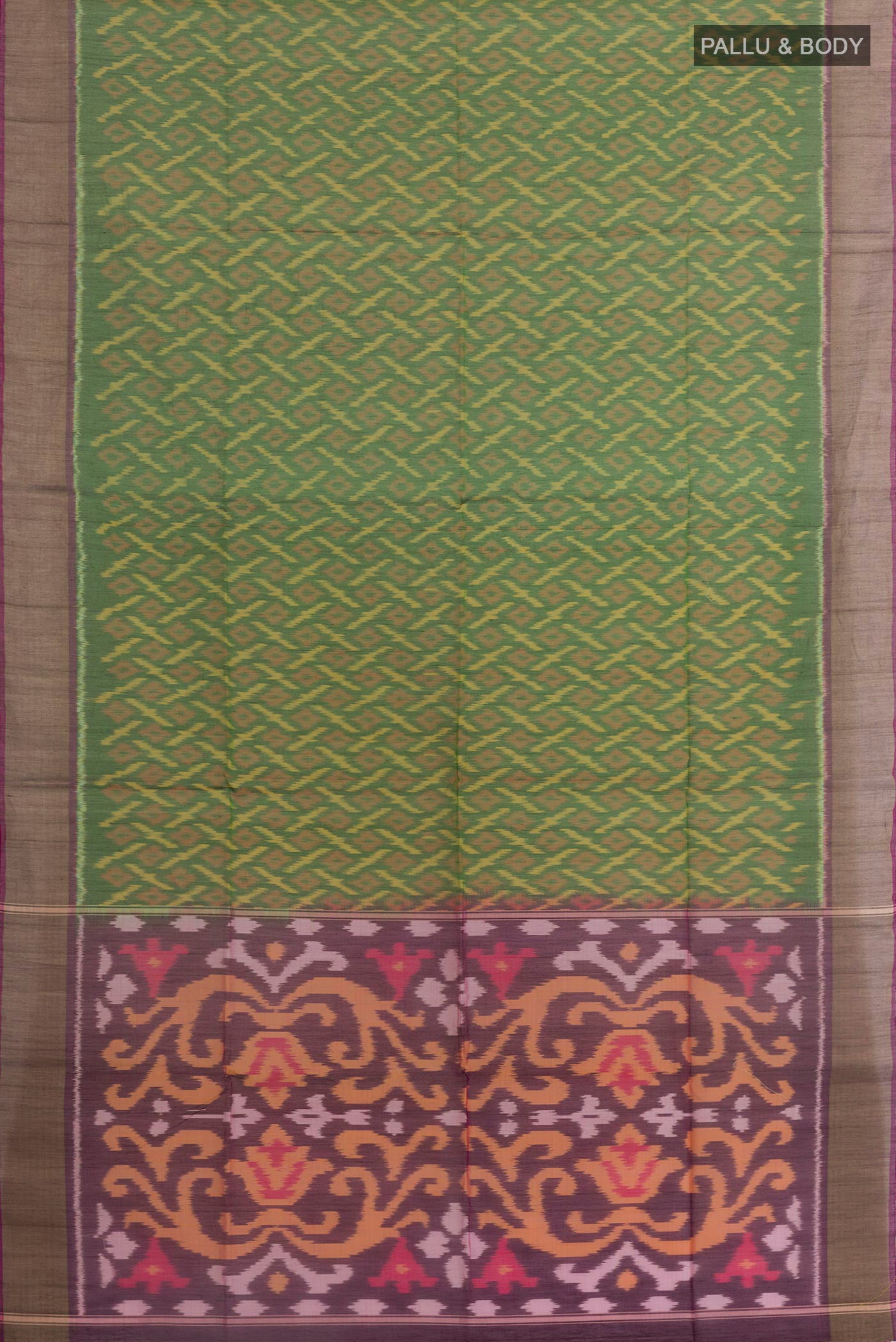 Flat view of Green Silk Cotton Saree with Ikat design on the body and Zari Border. 