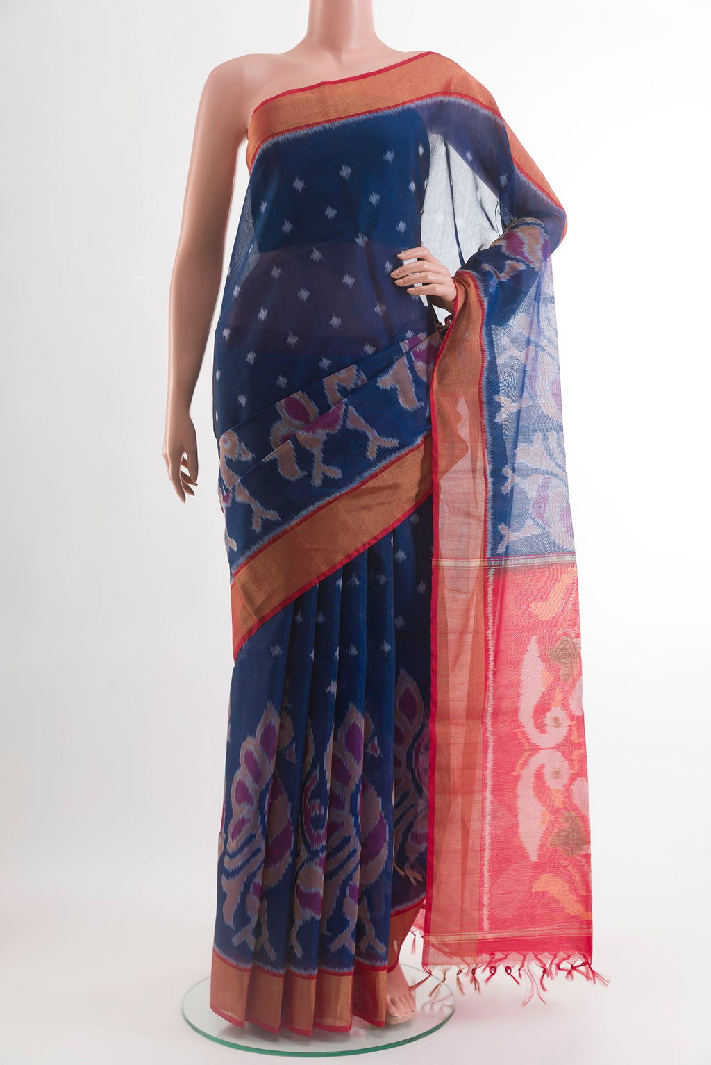 Blue Silk Cotton Saree with Ikat design on the body and Zari Border.  displayed on a mannequin