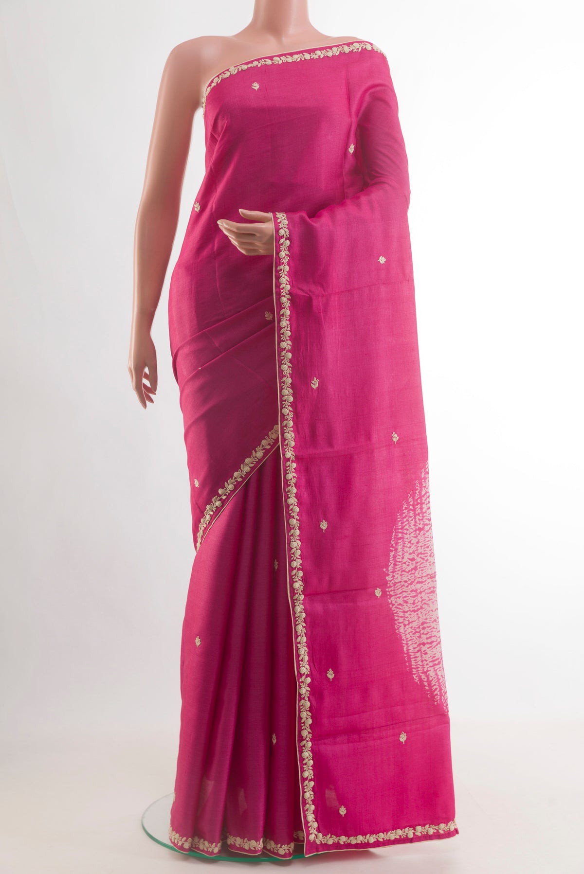 Pink Tussar Saree with Embroidery on the body and Embroidery Border.  displayed on a mannequin