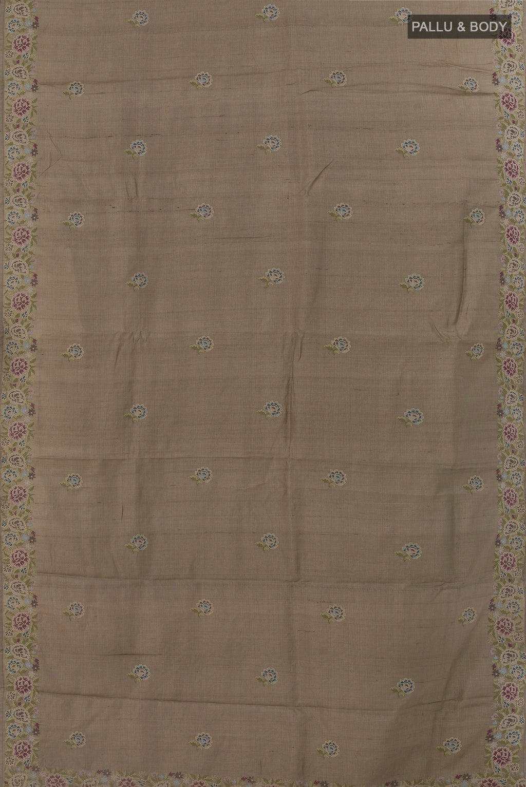 Flat view of Grey Tussar Silk Saree with Embroidery on the body and Embroidery Border. 