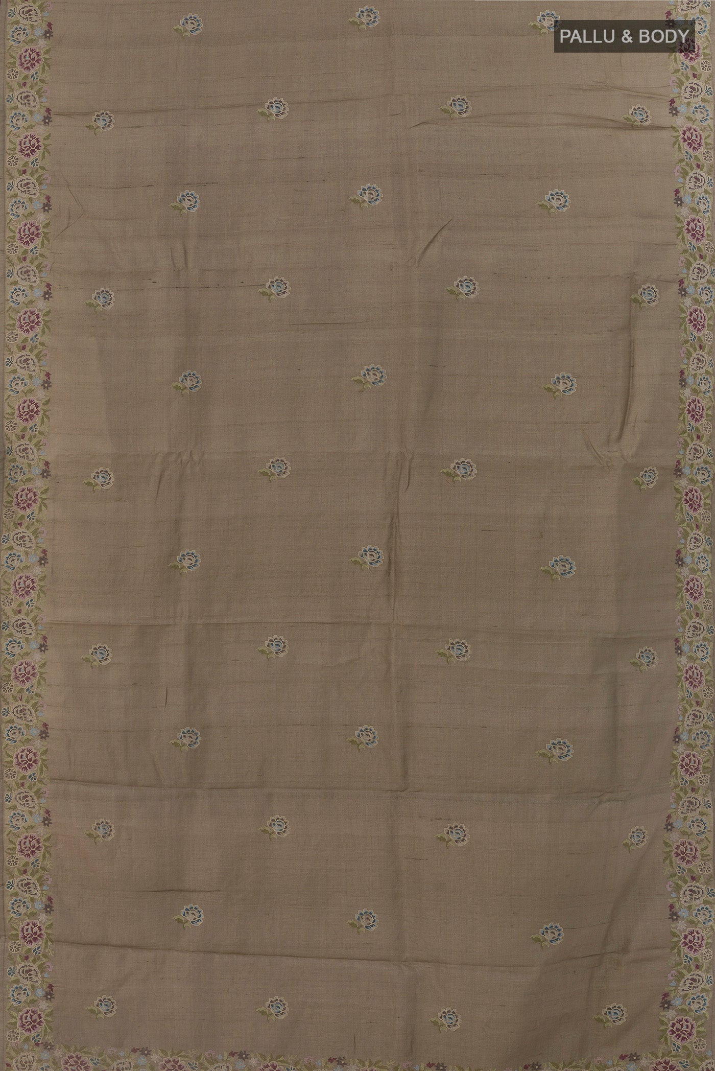 Flat view of Grey Tussar Silk Saree with Embroidery on the body and Embroidery Border. 
