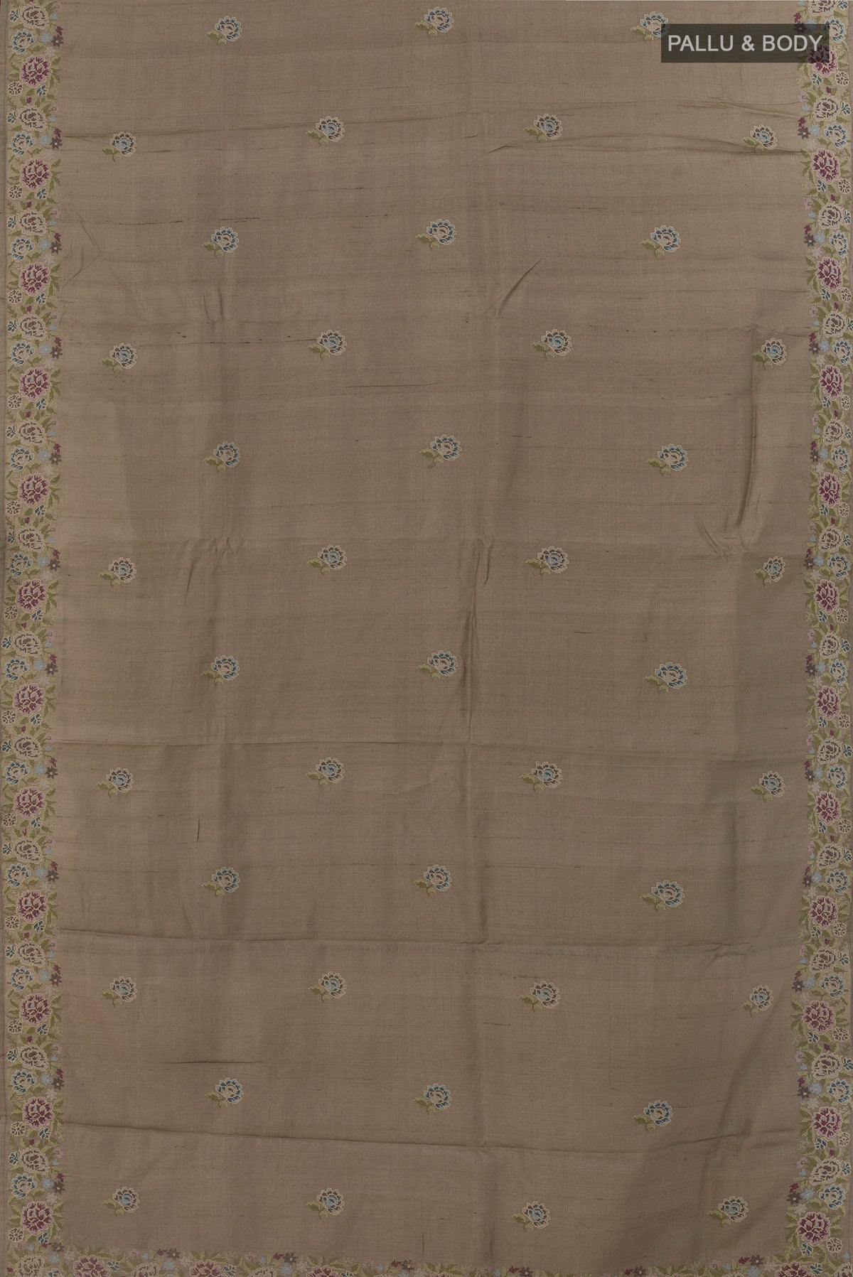 Flat view of Grey Tussar Silk Saree with Embroidery on the body and Embroidery Border. 