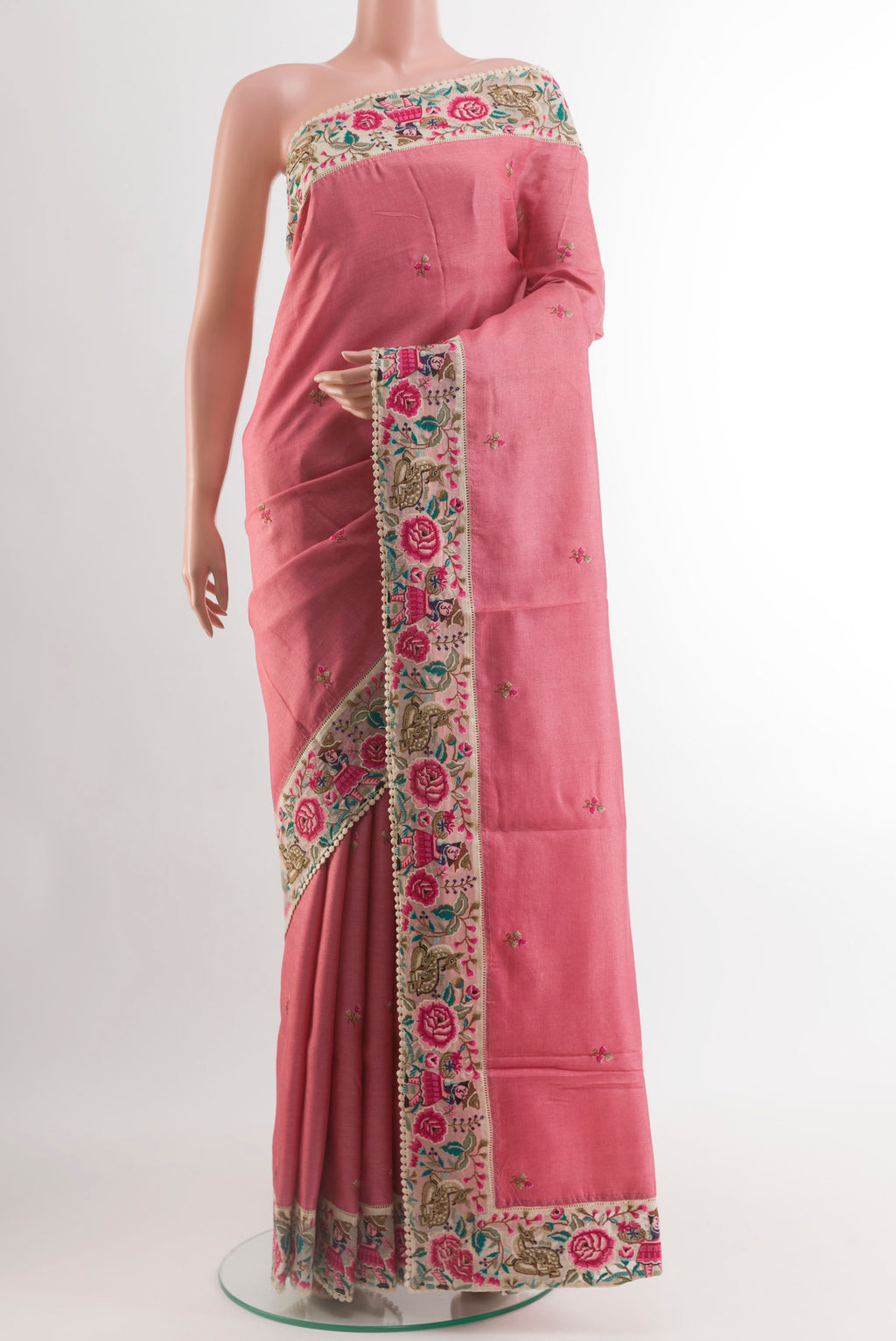 Pink Tussar Silk Saree with Embroidery on the body and Embroidery Border.  displayed on a mannequin