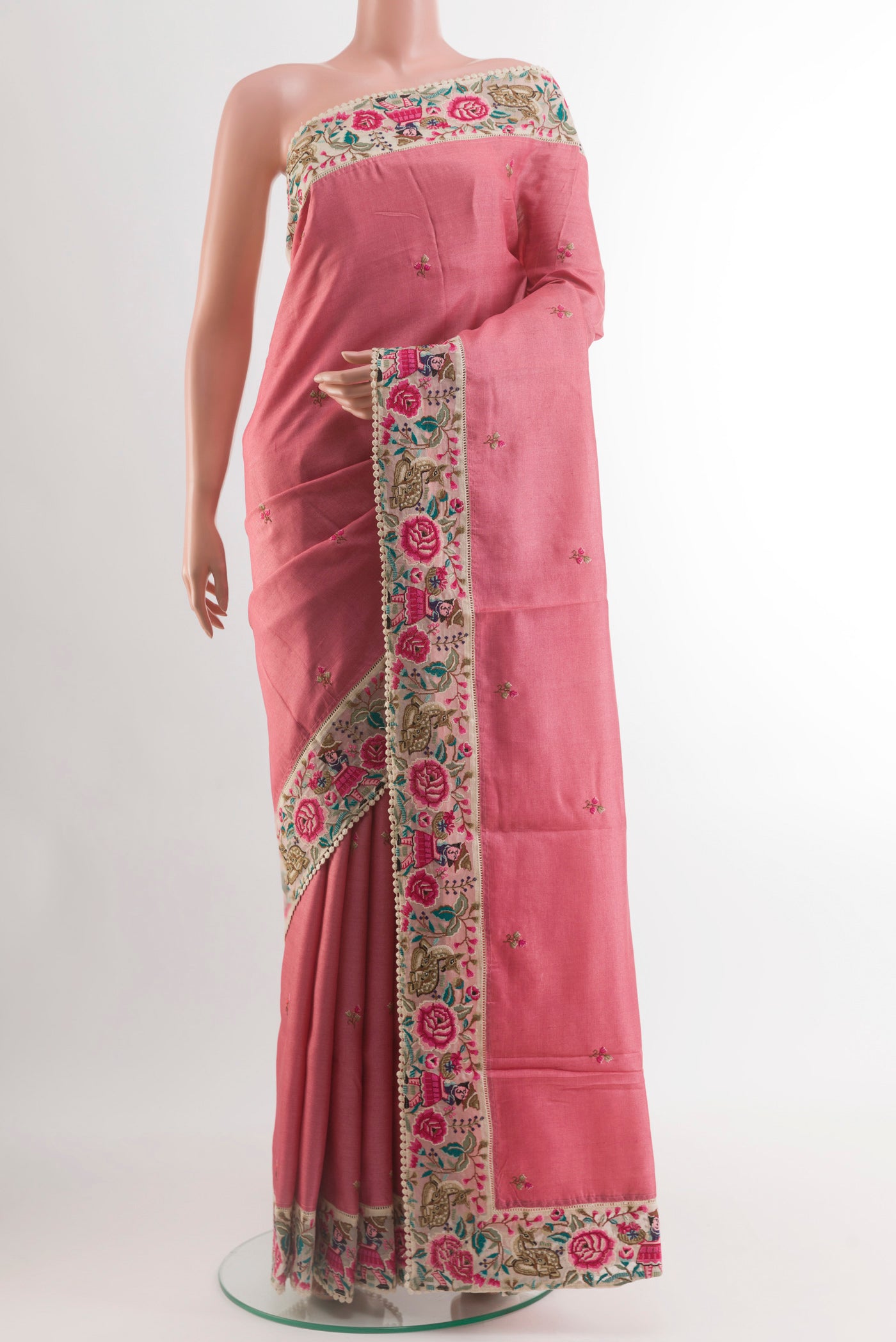 Pink Tussar Silk Saree with Embroidery on the body and Embroidery Border.  displayed on a mannequin