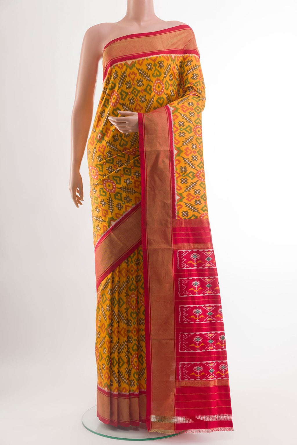 Yellow Pochampally Silk Saree with Pure Ikat on the body and Zari Border.  displayed on a mannequin