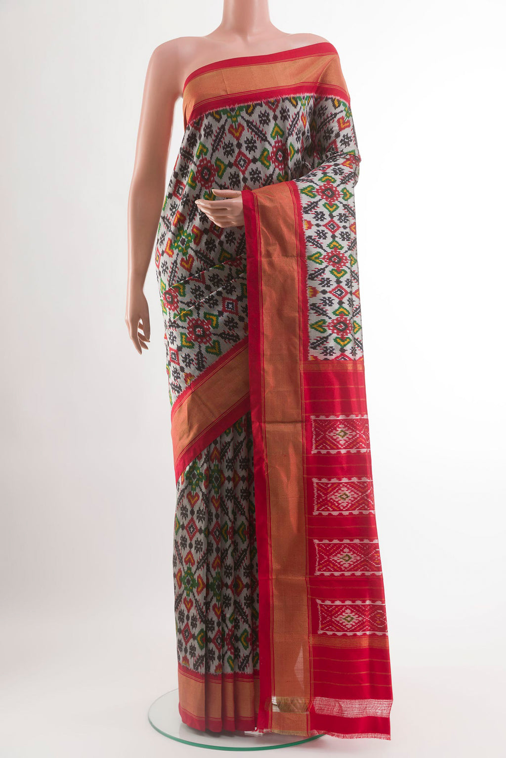 Silver Pochampally Silk Saree with Pure Ikat on the body and Zari Border.  displayed on a mannequin