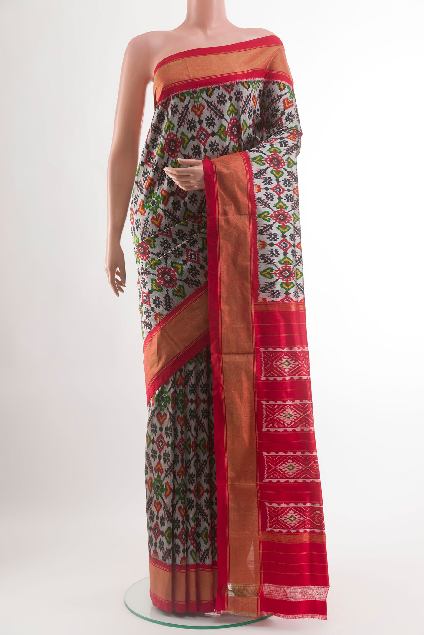 Silver Pochampally Silk Saree with Pure Ikat on the body and Zari Border.  displayed on a mannequin