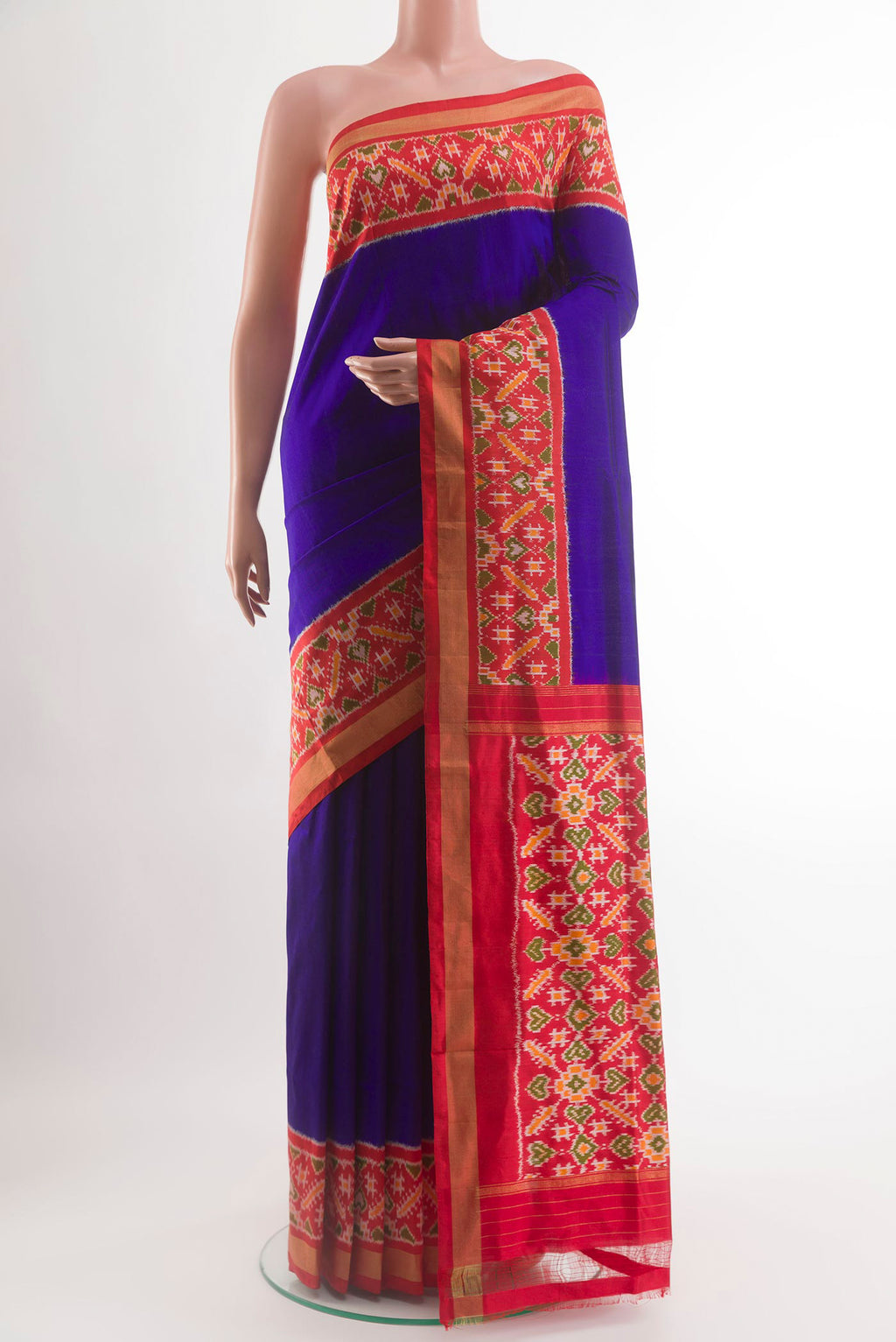 Blue Pochampally Silk Saree with Plain Body and Ikat Border.  displayed on a mannequin