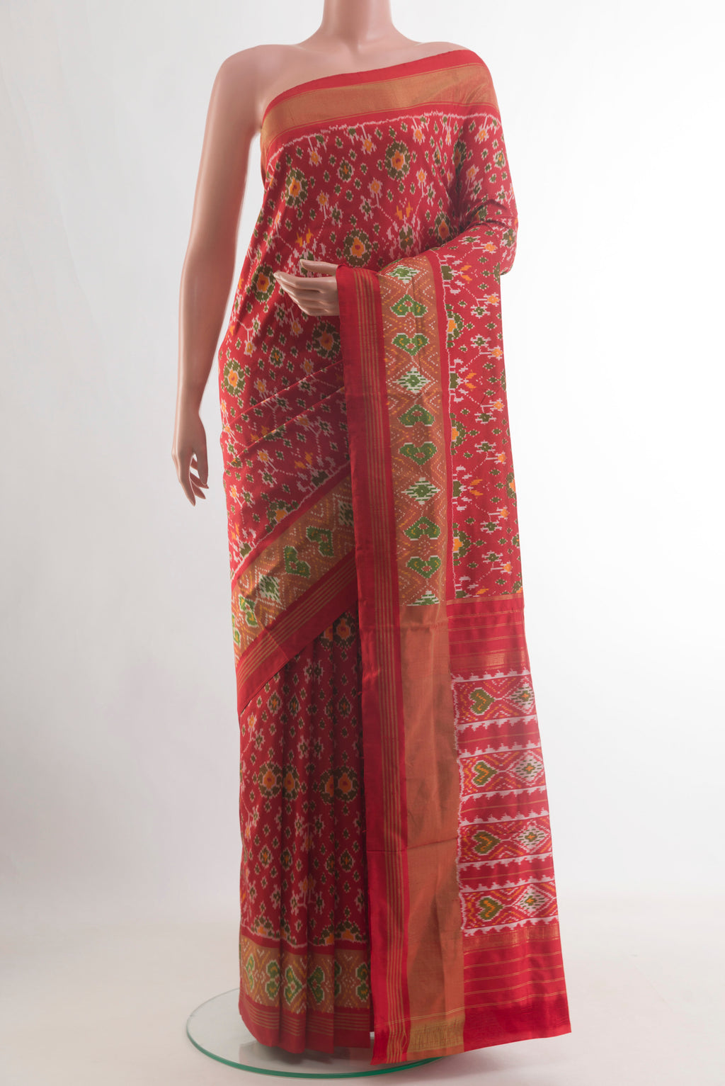 Red Pochampally Silk Saree with Pure Ikat on the body and Zari Border.  displayed on a mannequin