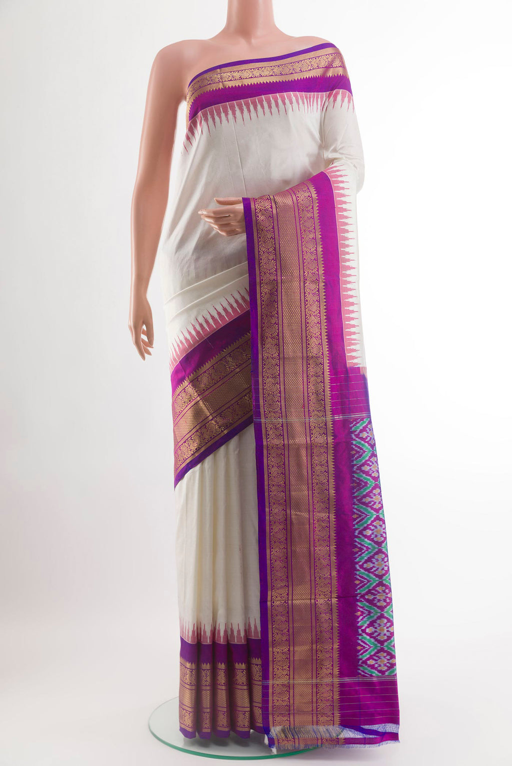 Off White Pochampally Silk Saree with Plain Body and Zari Border.  displayed on a mannequin