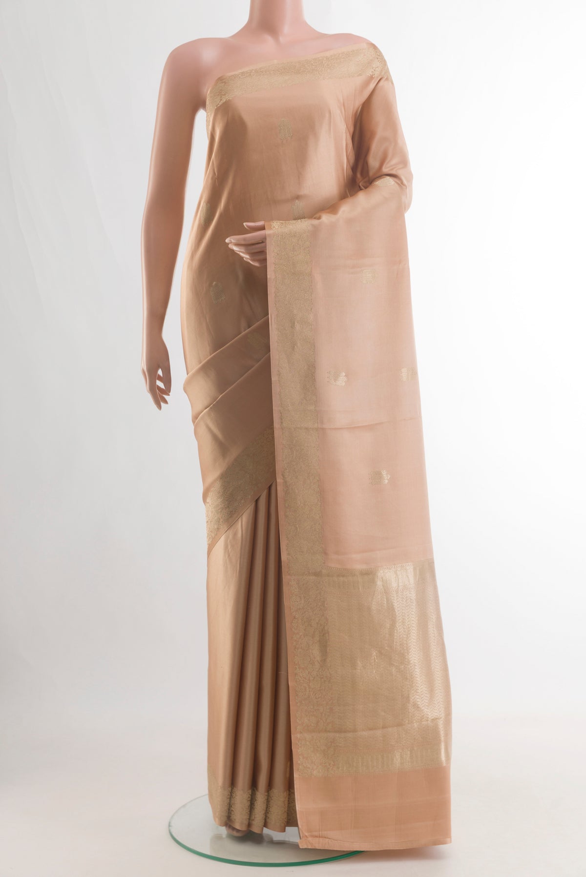Pure Silk Sandal Banarasi Silk Saree with Zari Butta on the body and Zari Border.  displayed on a mannequin