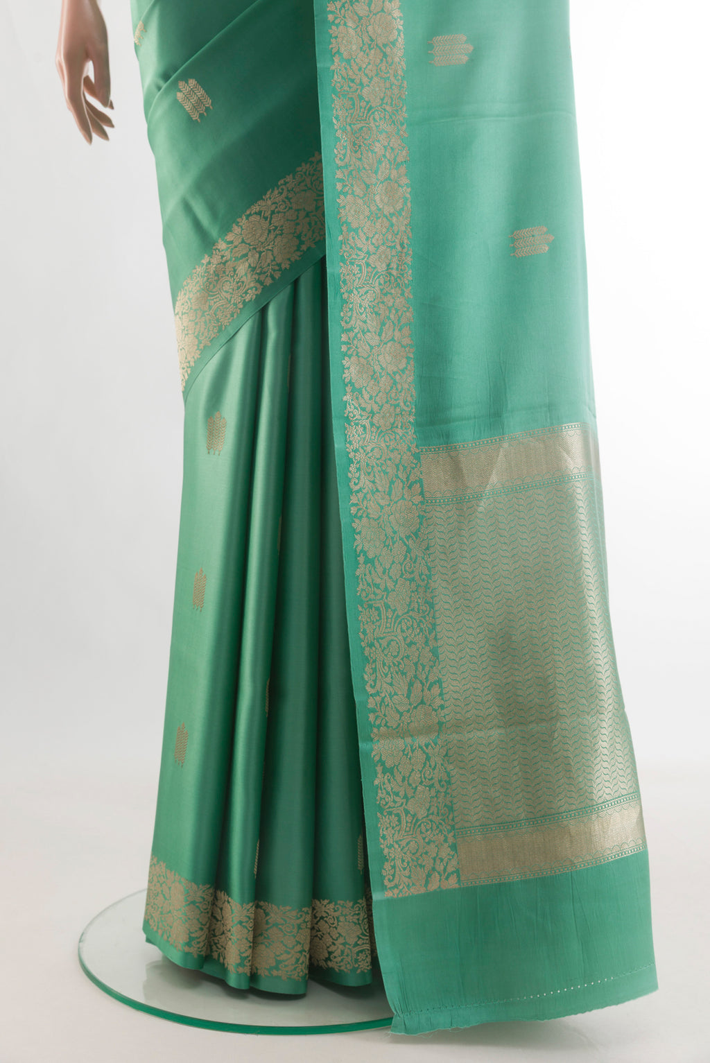 Pleats and pallu of Sea Green Banarasi Silk Saree with Zari Butta on the body and Zari Border. 