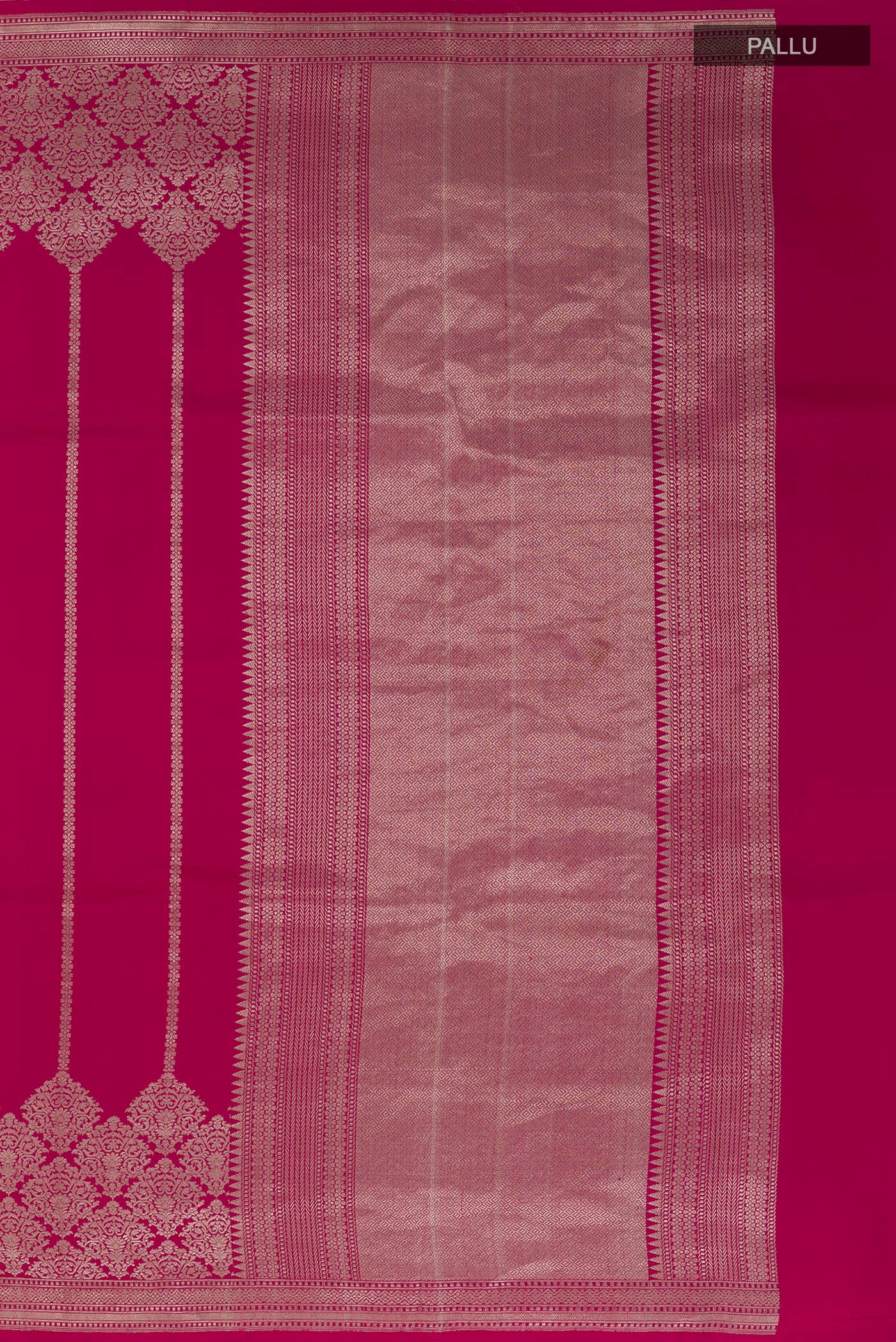 Close up image of the pallu of Rani Pink Banarasi Silk Saree with Stripes on the body and Zari Border. 