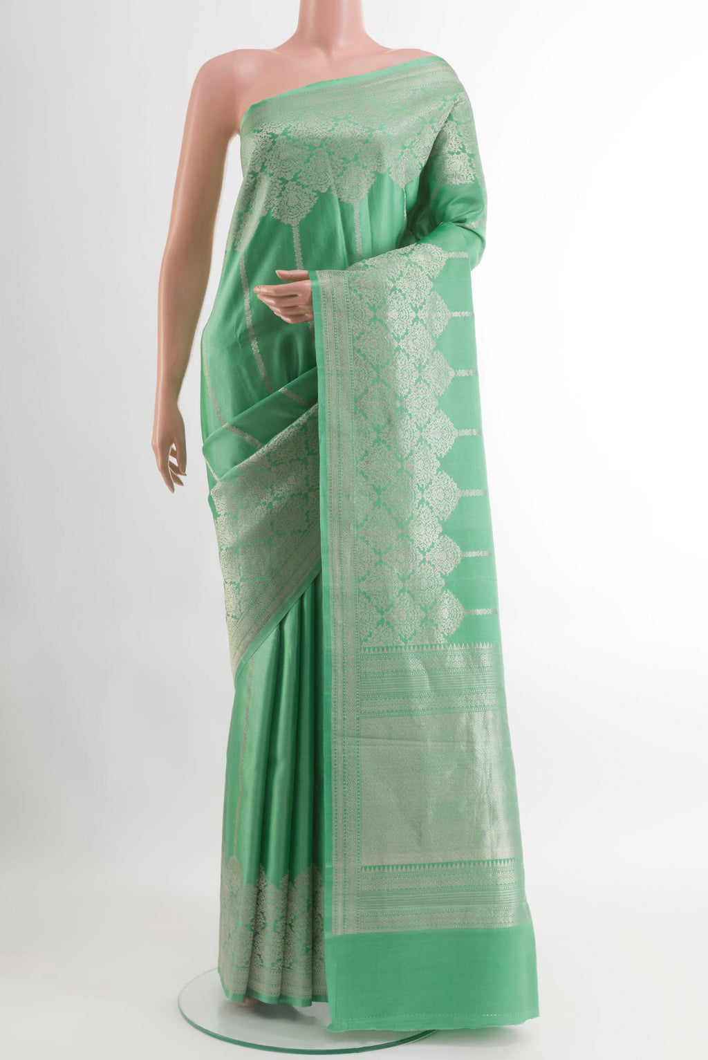 Sea Green Banarasi Silk Saree with Stripes on the body and Zari Border.  displayed on a mannequin