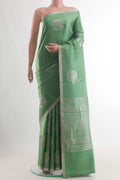 Green Banarasi Silk Saree with Zari Butta on the body and Zari Border.  displayed on a mannequin