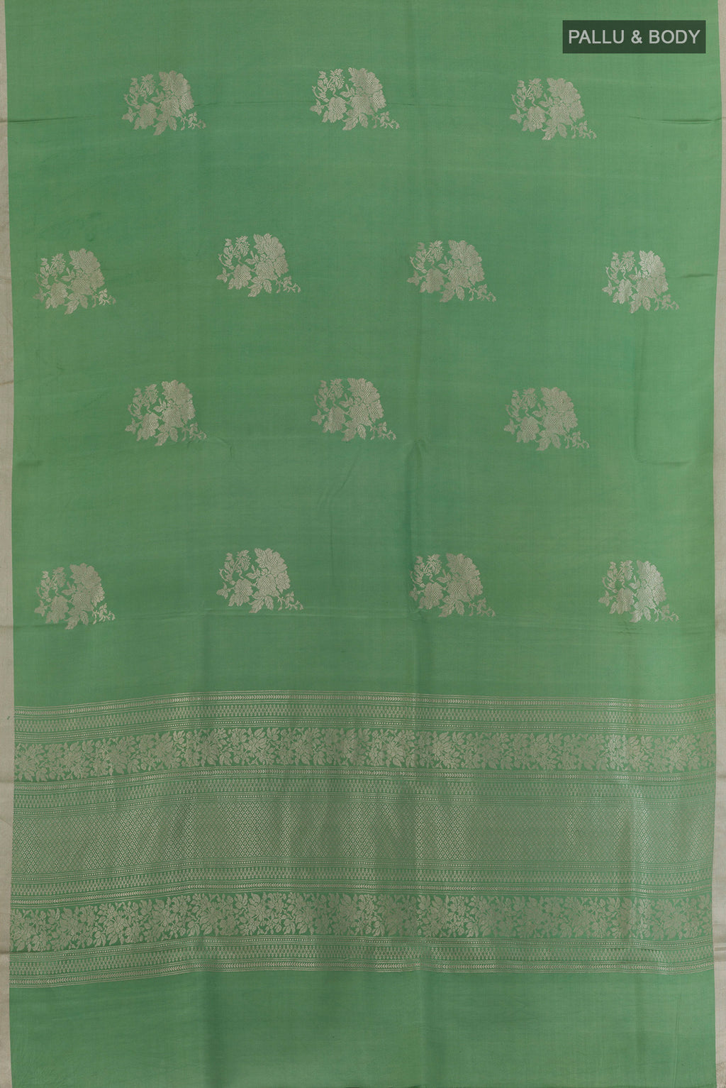Flat view of Green Banarasi Silk Saree with Zari Butta on the body and Zari Border. 