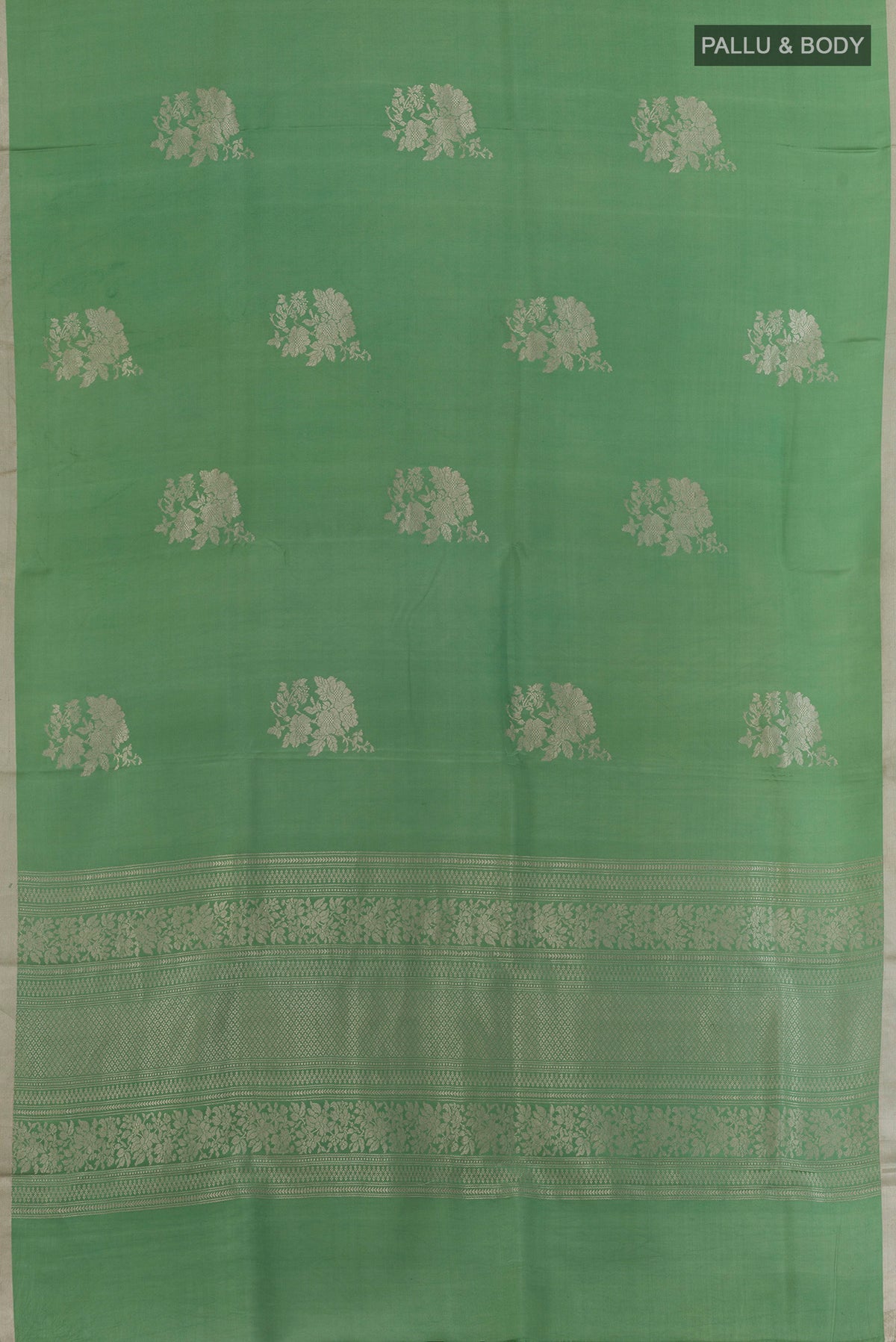 Flat view of Green Banarasi Silk Saree with Zari Butta on the body and Zari Border. 