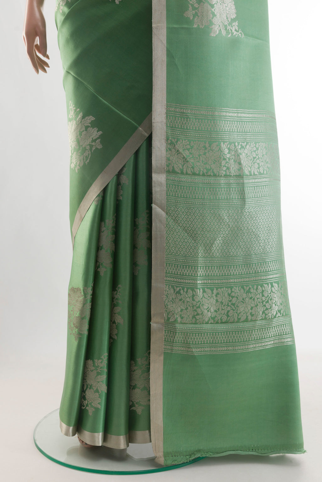 Pleats and pallu of Green Banarasi Silk Saree with Zari Butta on the body and Zari Border. 