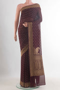 Brown Banarasi Georgette Saree with Zari Butta on the body and Zari Border.  displayed on a mannequin
