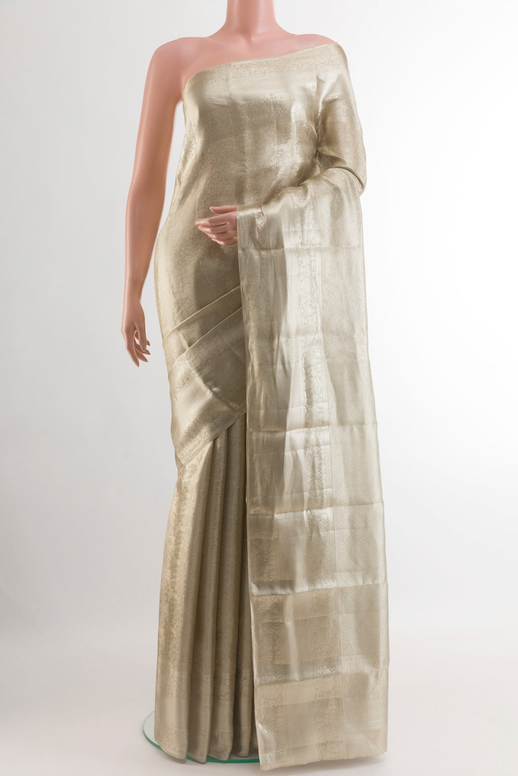 Silver Dual Tone Kanjivaram Tissue Silk Saree with Zari Brocade on the body and Zari Border.  displayed on a mannequin
