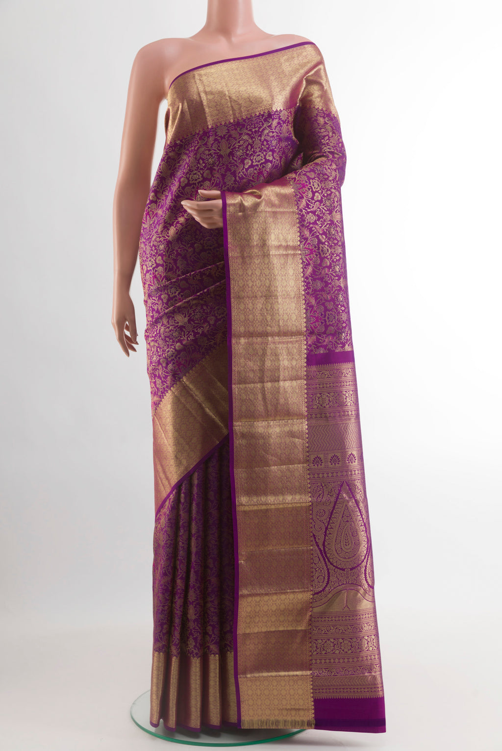 Purple Kanchipuram Silk Saree with Zari Brocade on the body and Zari Border.  displayed on a mannequin